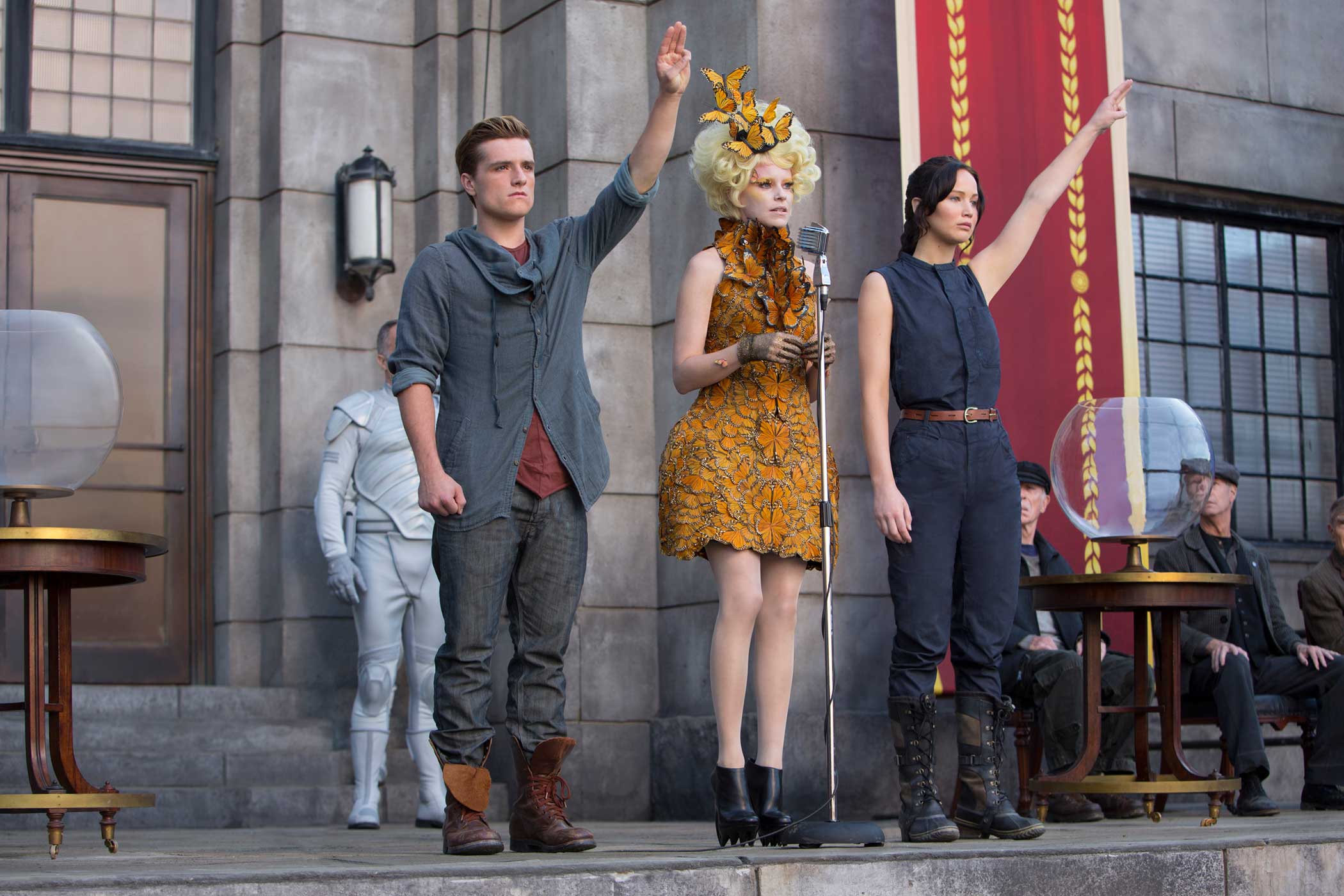From left: Josh Hutcherson as Peeta Mellark, Elizabeth Banks as Effie Trinket, and Jennifer Lawrence as Katniss Everdeen in The Hunger Games: Catching Fire, 2013.