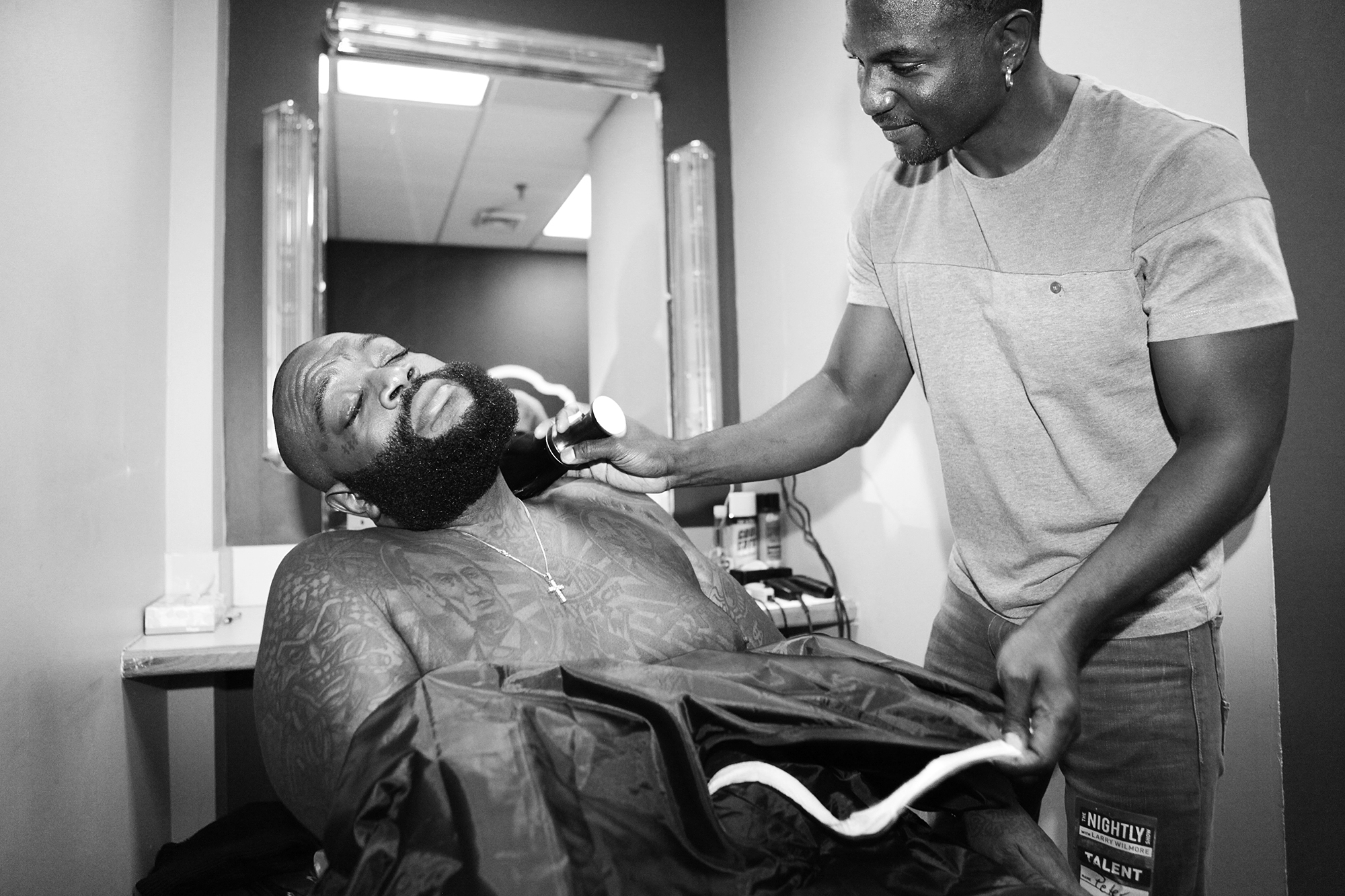 From left: Rick Ross and barber Peter Graham backstage at The Nightly Show with Larry Wilmore on Nov. 12, 2015 in New York City.