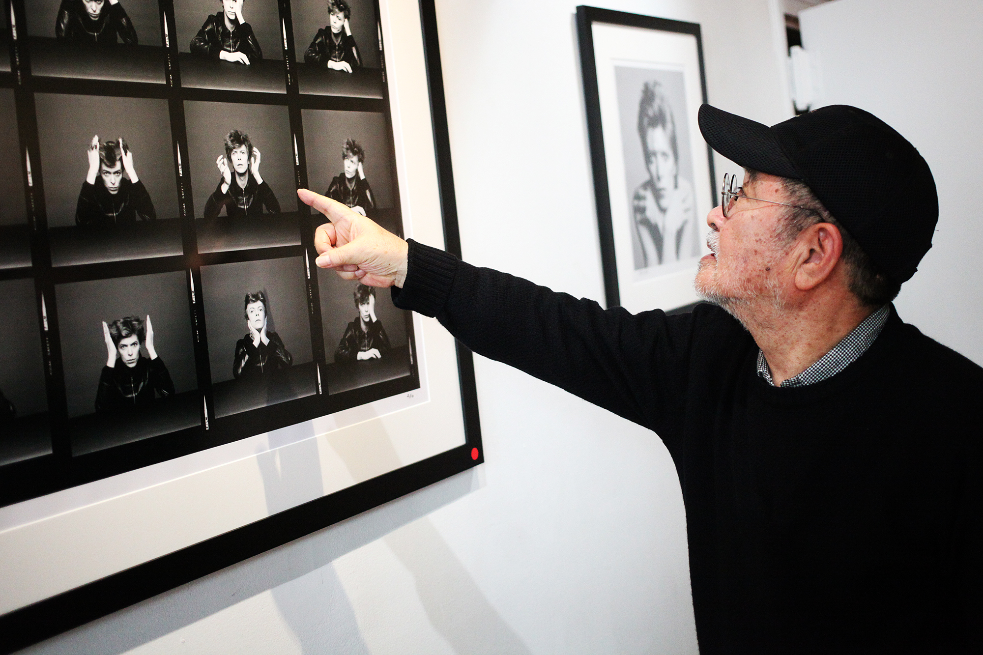 Masayoshi Sukita points out his favorite image from his shoot with David Bowie for the Heroes album cover at the Morrison Hotel Gallery in New York City on Nov. 13, 2015.