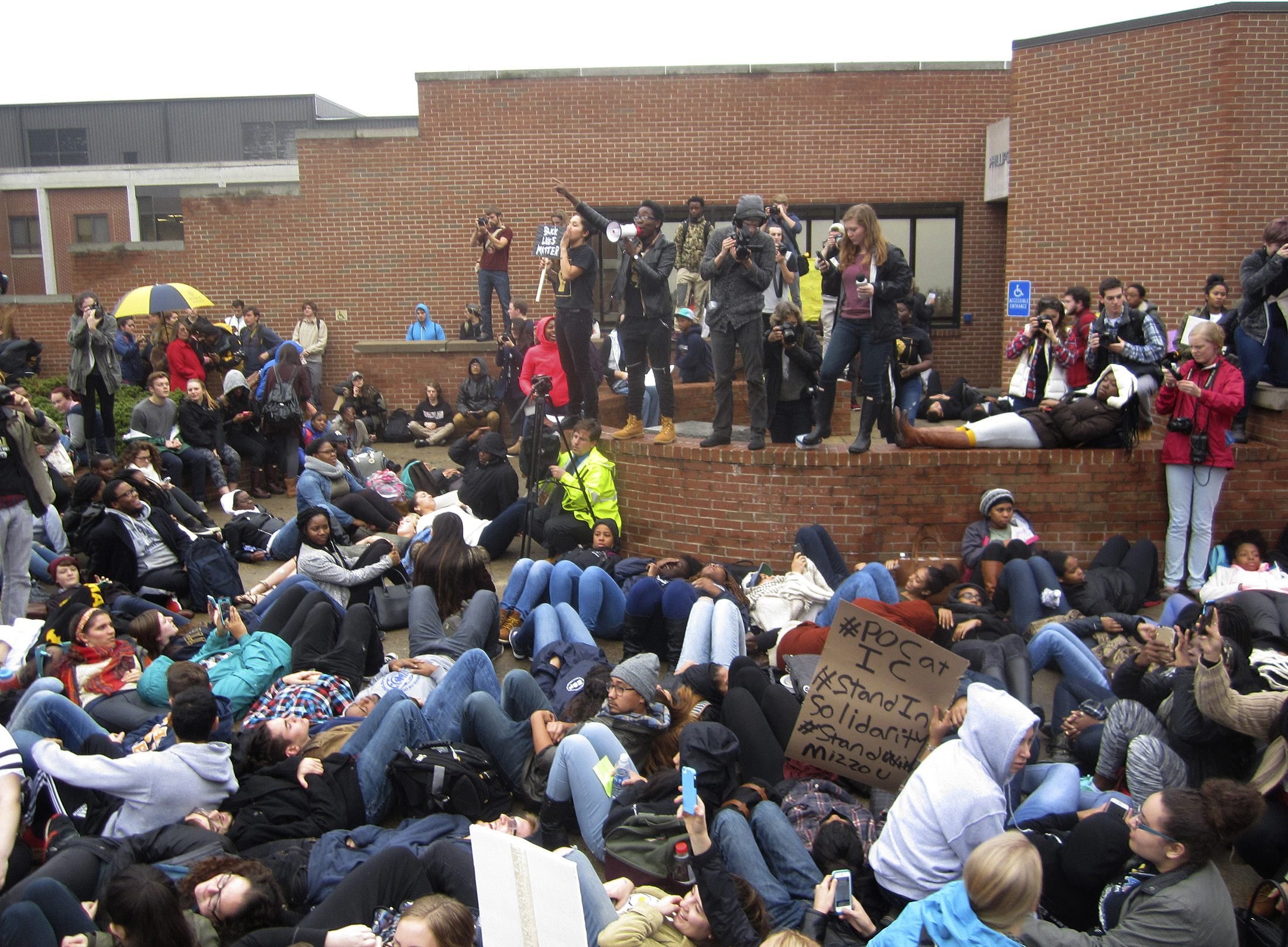 Protestorsr encourage students to lay down as part of a 'die-in' this afternoon at Ithaca College in Ithaca, New York on Nov. 11, 2015. (Matthew Liptak—Reuters)