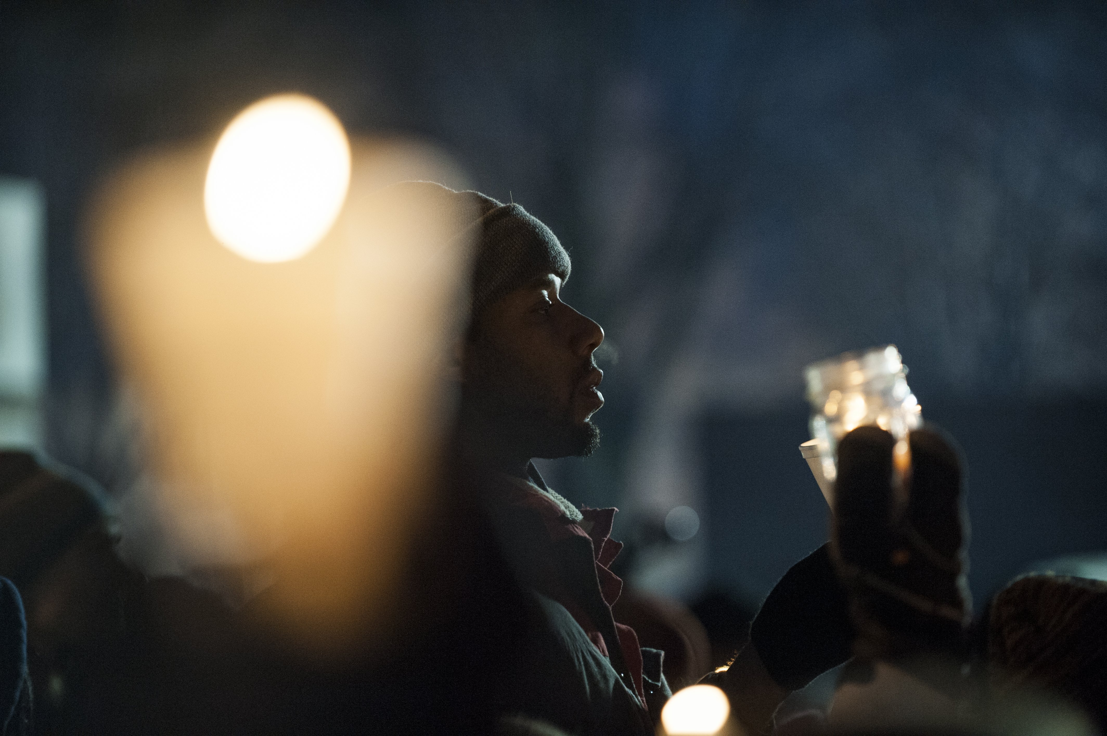 Protestors, activists, and community members listen to speeches at a candlelight vigil held for Jamar Clark outside the 4th police precinct  in Minneapolis on Nov. 20, 2015. (Stephen Maturen—Getty Images)
