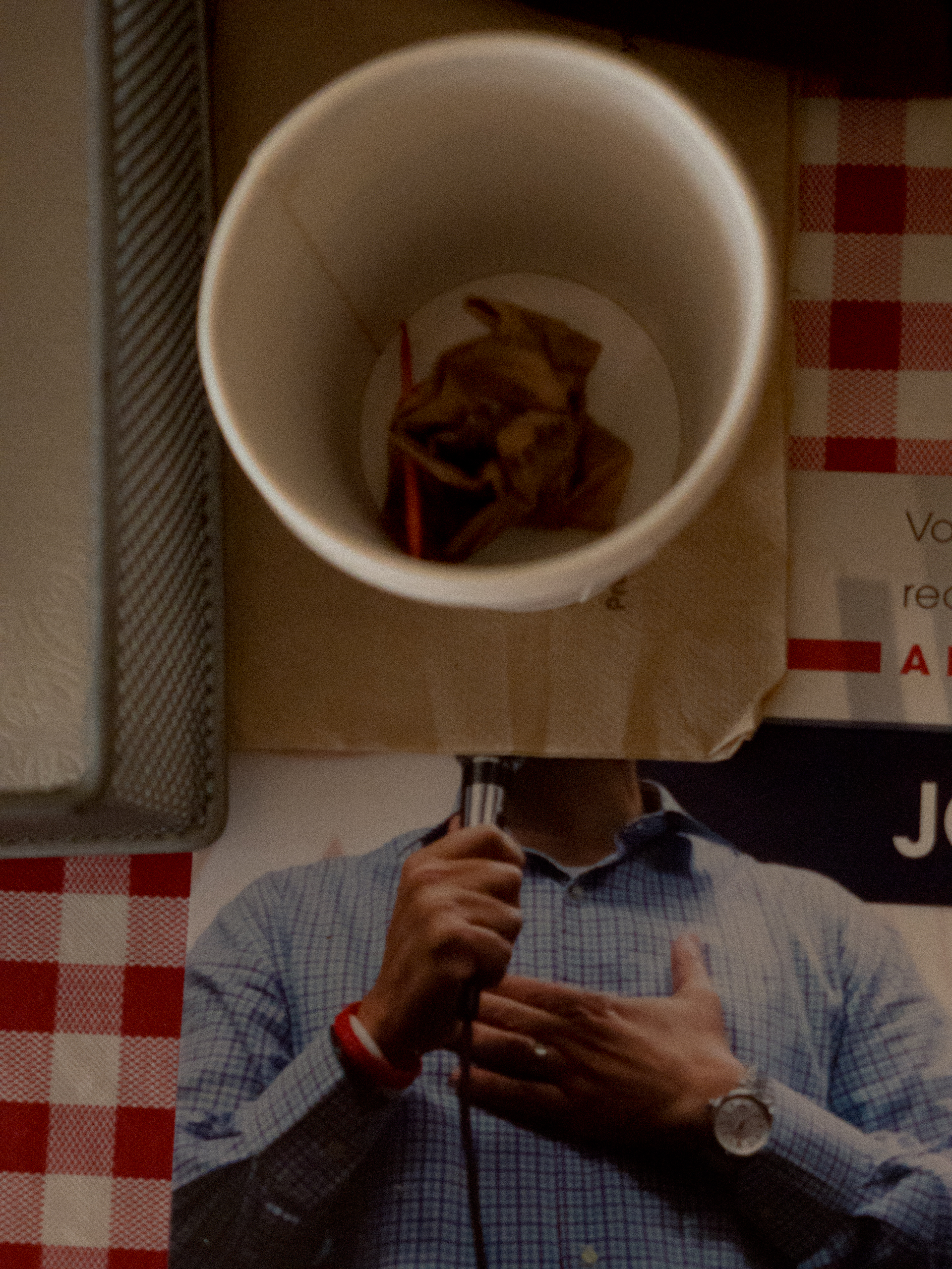 Cup with tea bag sitting on campaign literature at rally for Marco Rubio, Hooksett, NH 2015.