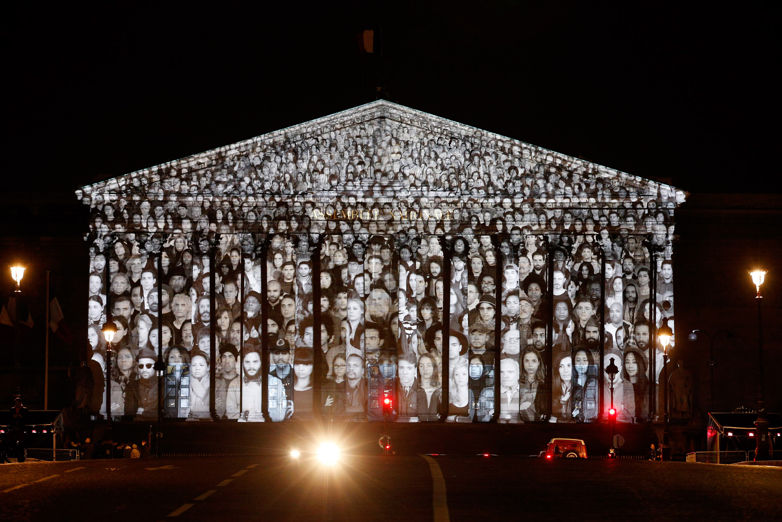 An artwork by French artist JR and U.S. filmmaker Darren Aronofsky is projected onto the French National Assembly building on the eve of the COP21 climate conference in Paris on Nov. 29 2015 (Yoan Valat—EPA)