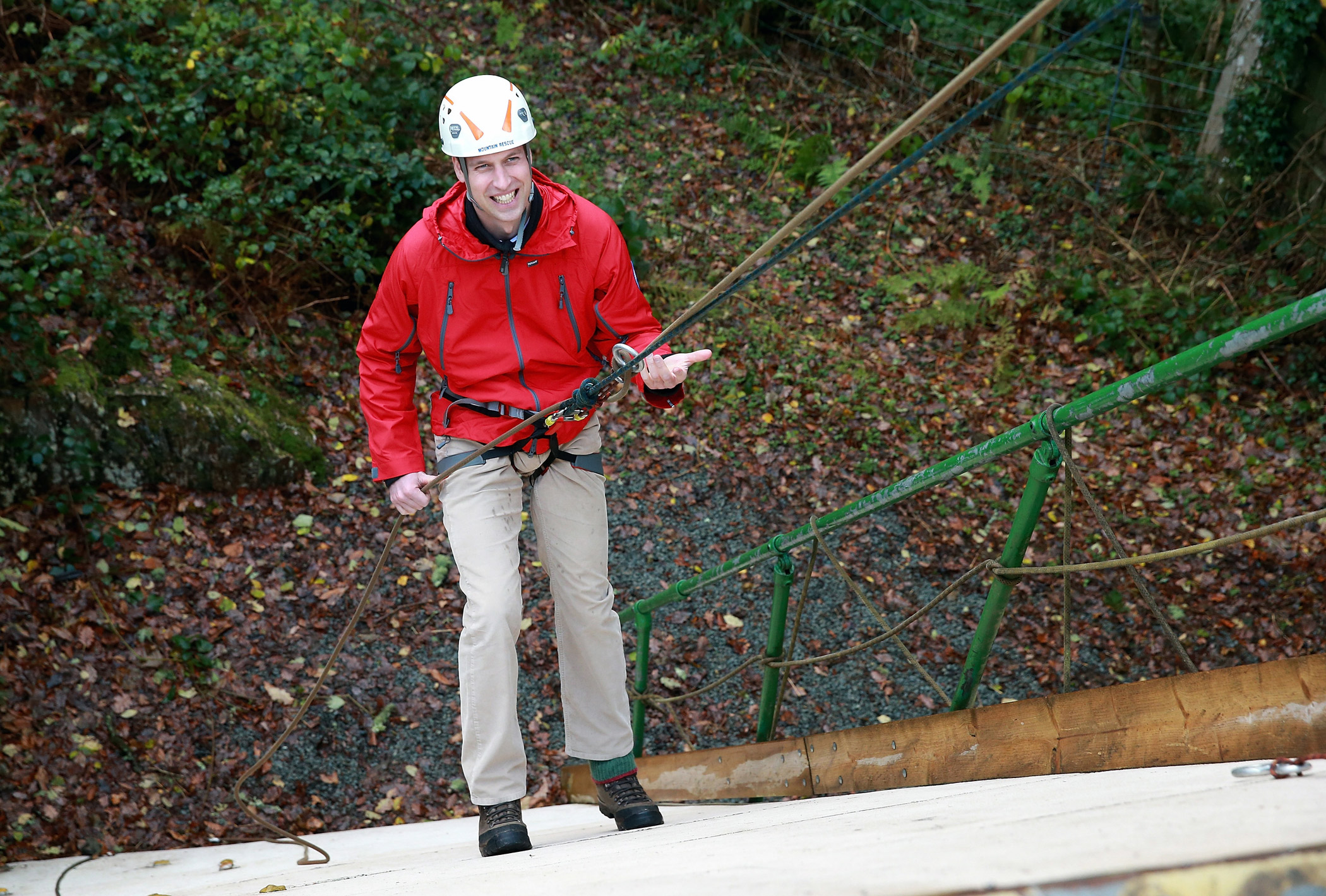 Prince William, Duke of Cambridge, abseils down a wall at the Towers Residential Outdoor Education Centre.