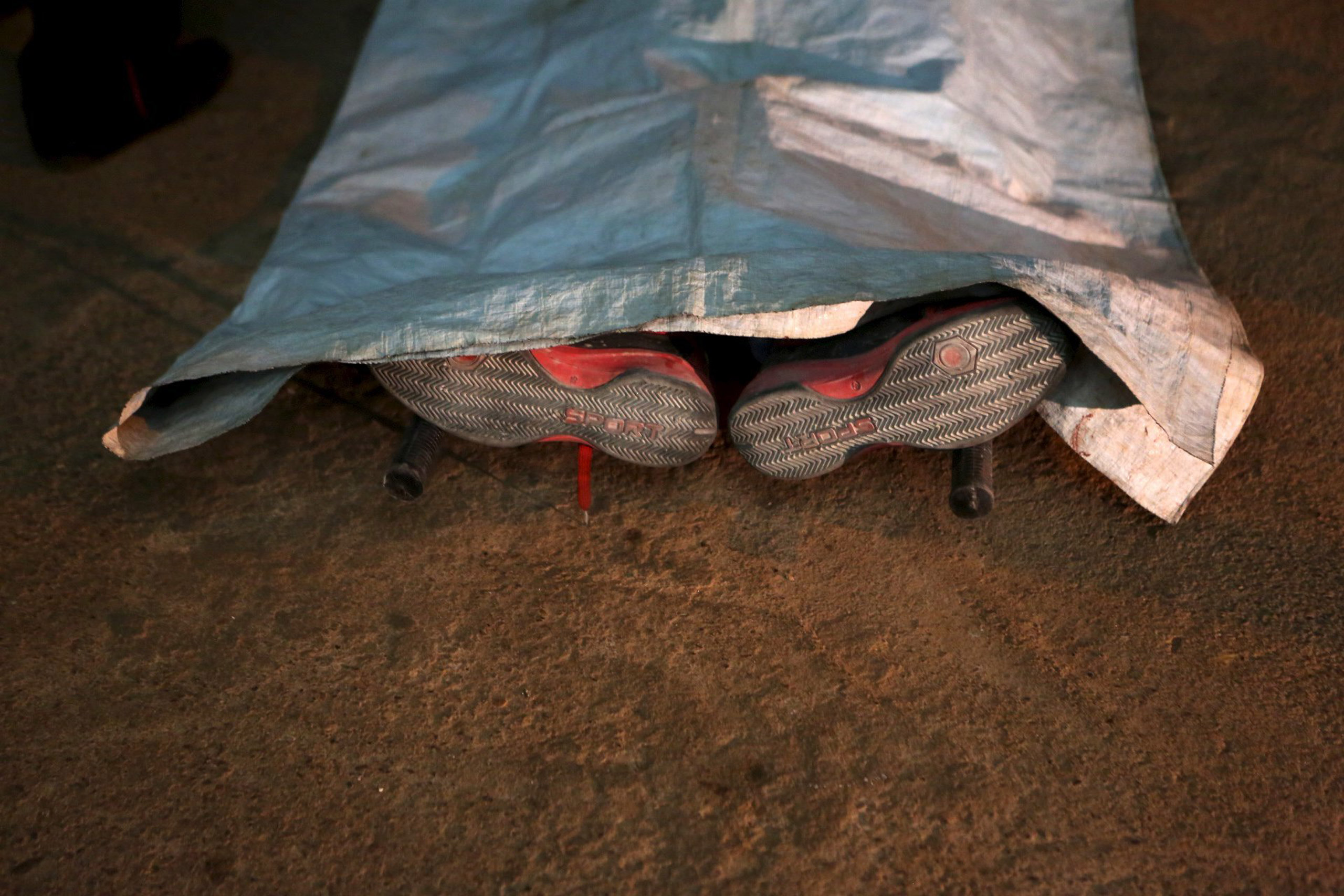A corpse is seen outside the Radisson hotel in Bamako, Mali, on Nov. 20, 2015.
