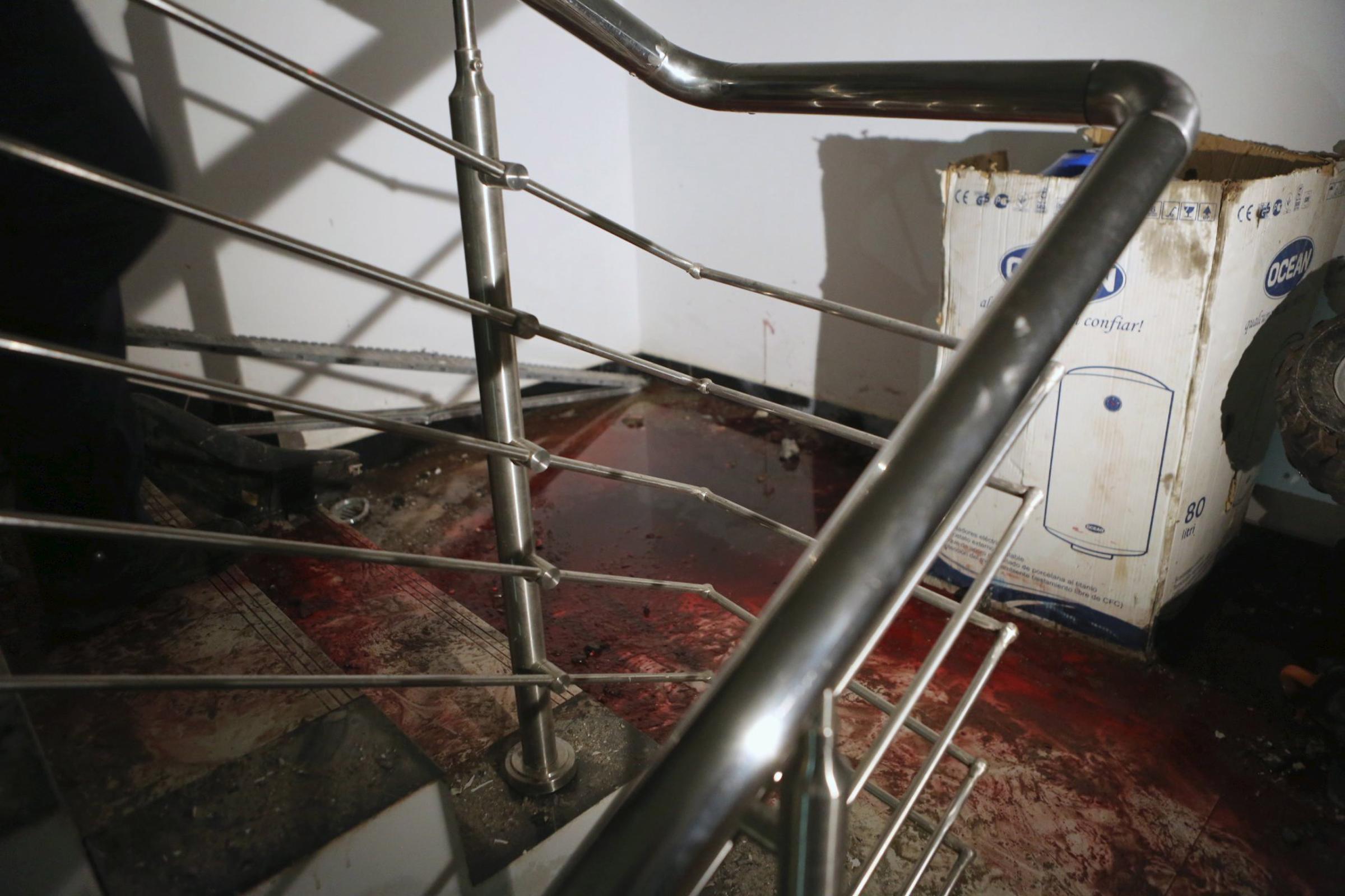 Blood is seen at a staircase of the Radisson hotel in Bamako