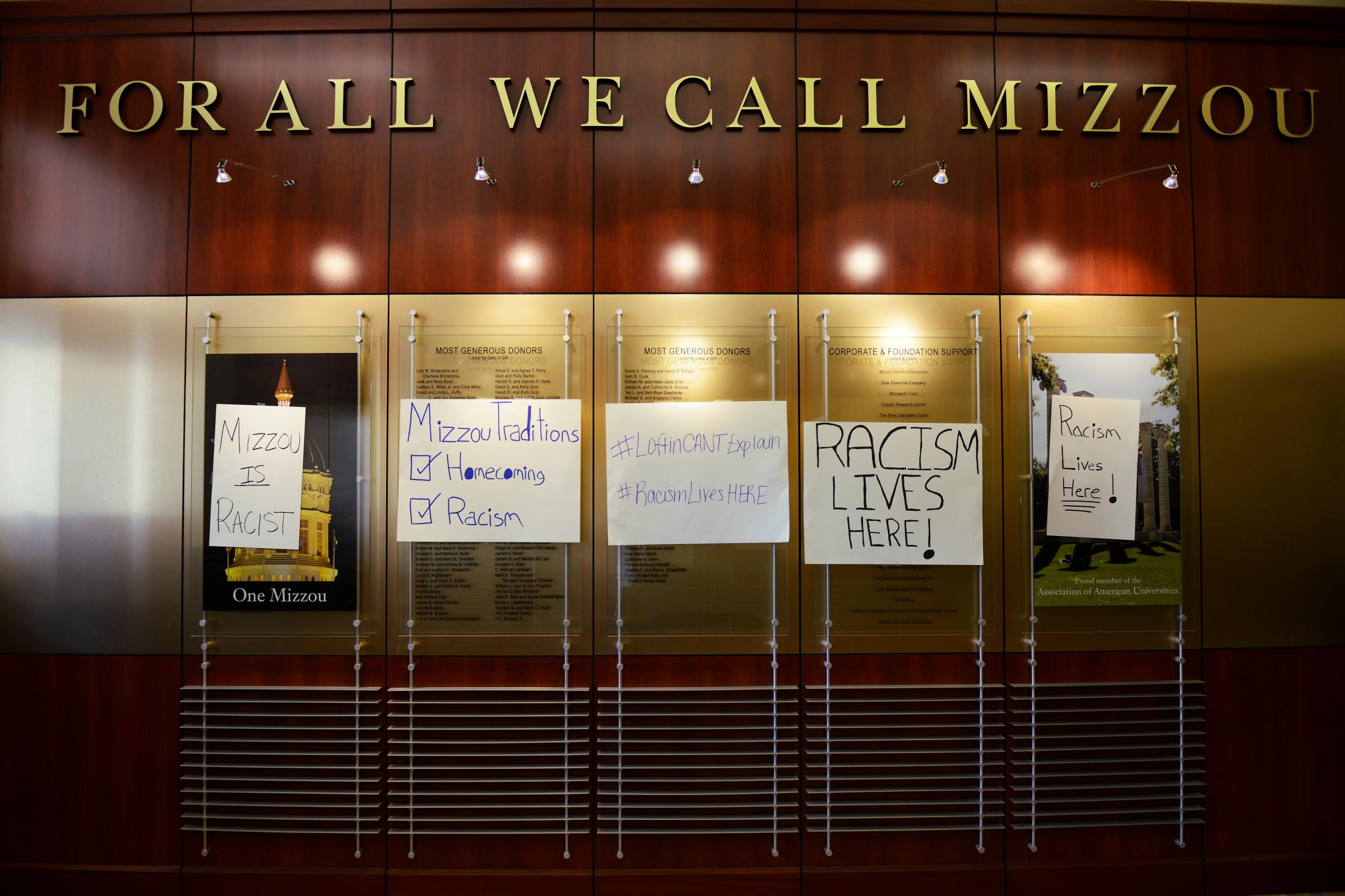 Posters from a "#RacismLivesHere" rally are displayed at Jesse Hall at the University of Missouri campus following a student march on Sept. 24, 2015 in Columbia, Mo. Students said that racism is a problem on their campus.