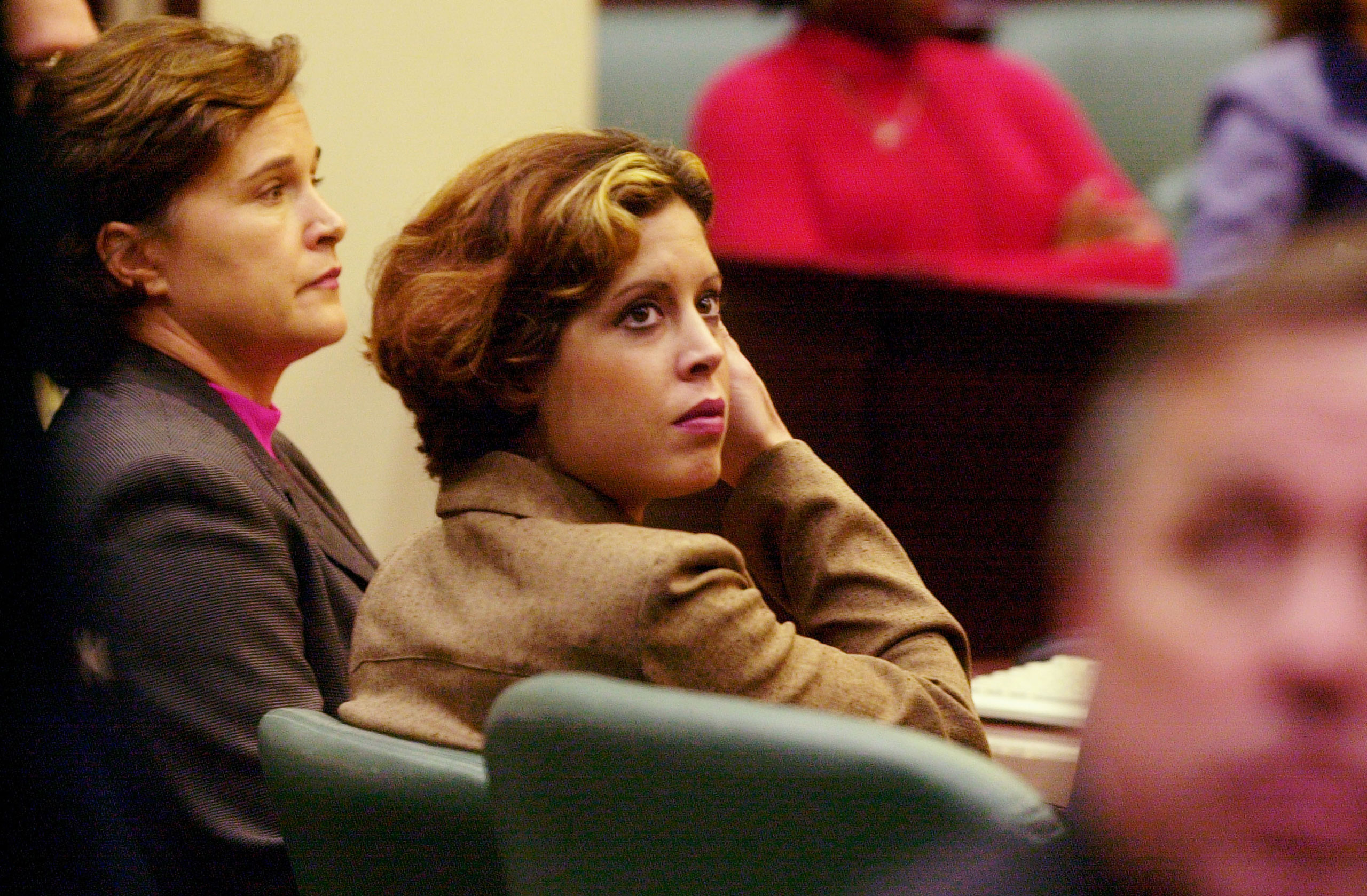 Noelle Bush (center) waits with her aunt Dorothy Bush Koch (left) for the start of her court hearing in an Orange County courtroom on Oct. 17, 2002 in Orlando, Fla. (Red Huber—Getty Images)
