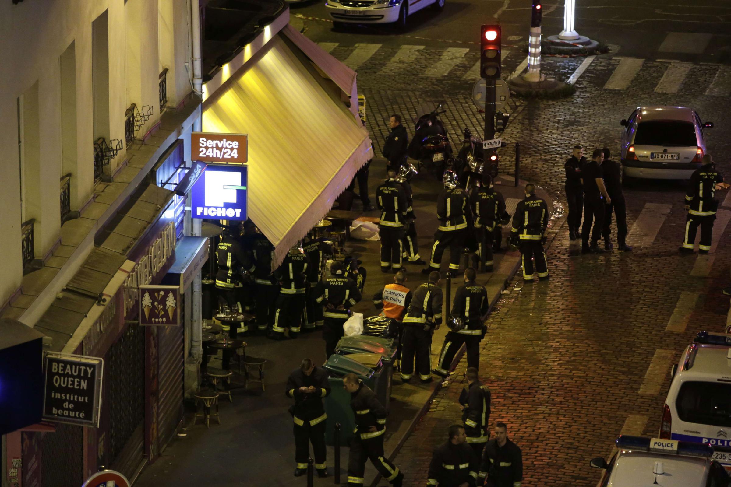 Police are seen outside a restaurant in 10th arrondissement of the French capital Paris on Nov. 13, 2015.