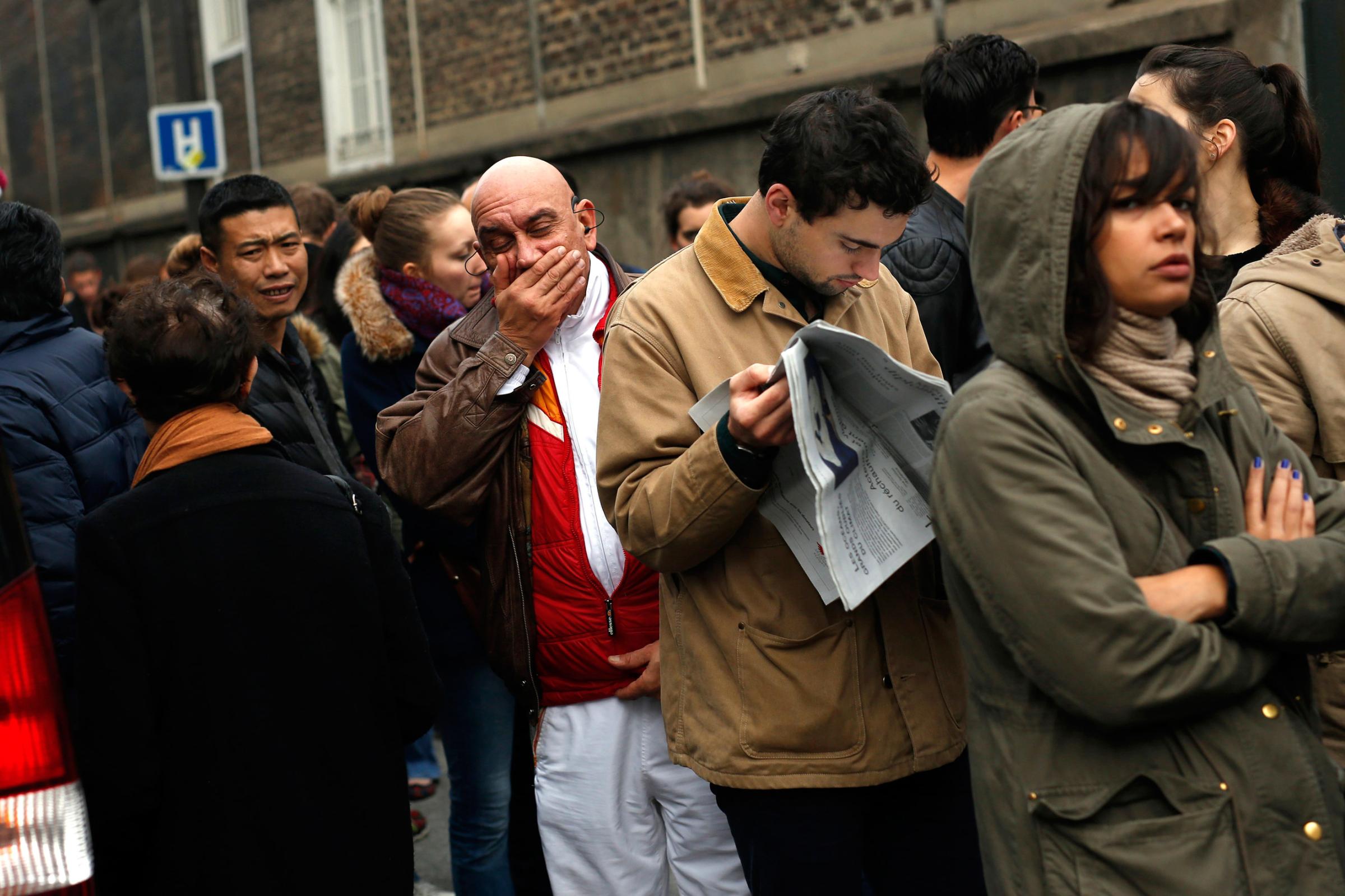 People line up to give blood at the St Louis hospital across the street from the Petit Cambodge restaurant in Paris on Nov. 14, 2015.