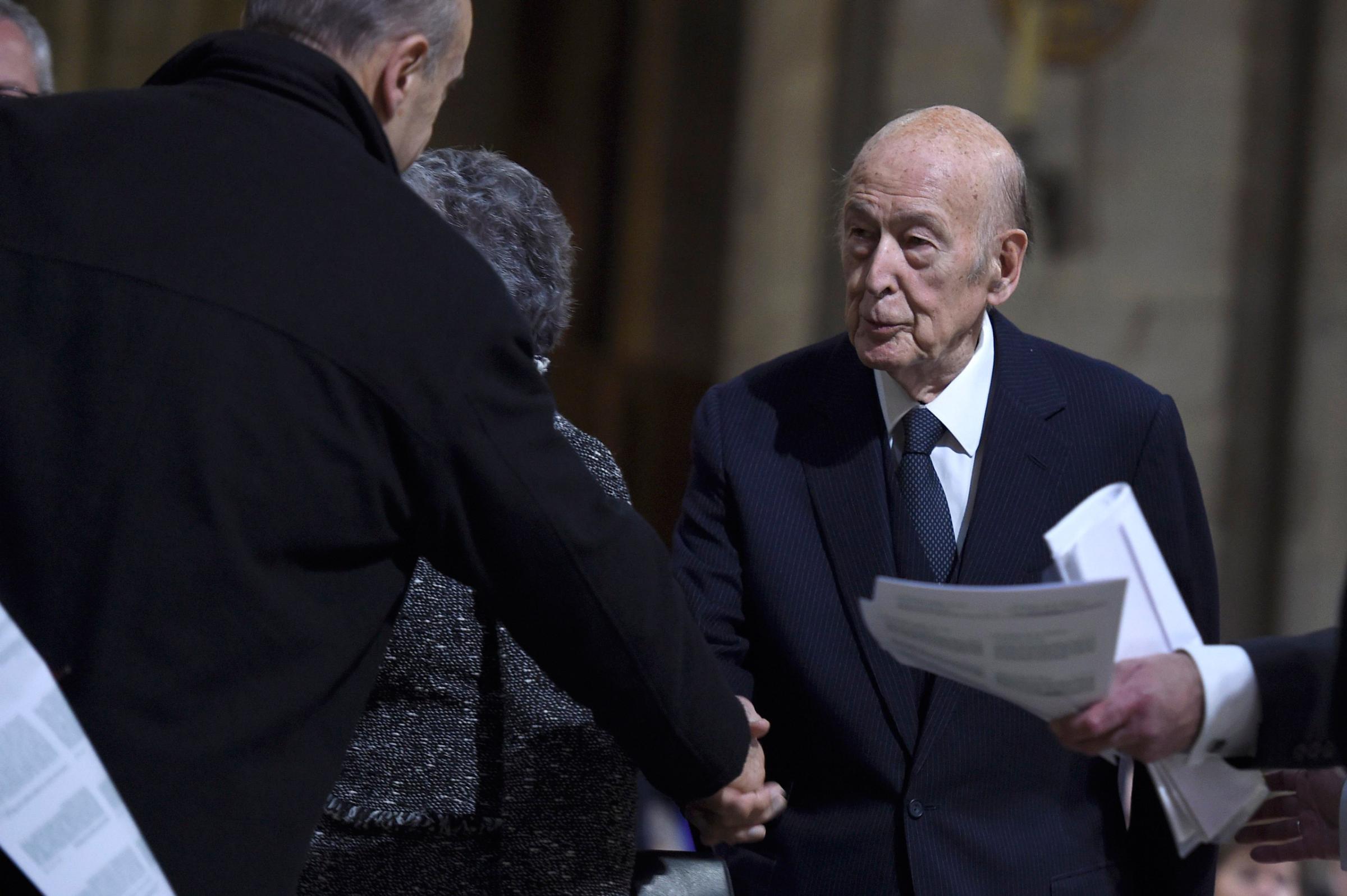 Former French President Valery Giscard d'Estaing arrives to attend mass at the Notre Dame Cathedral in Paris, France, November 15, 2015, that is held in homage to the victims of a series of fatal shootings in the French capital on Friday. REUTERS/Lionel Bonaventure/Pool