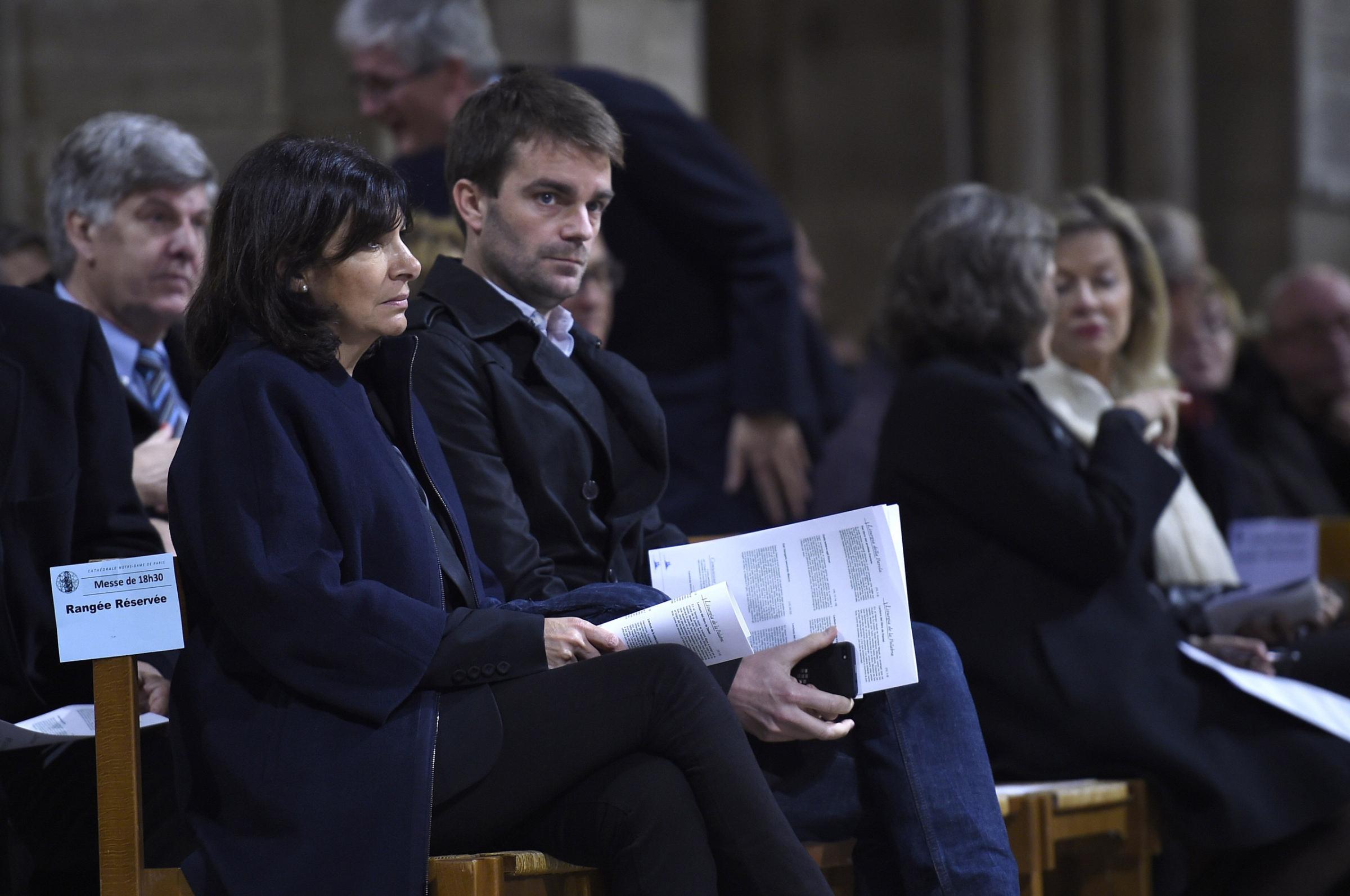 Paris mayor Anne Hidalgo (L) and Deputy-Mayor Bruno Julliard attend a mass service in homage to the attacks' victims at the Notre-Dame cathedral in Paris on November 15, 2015, two days after a series of deadly attacks. Islamic State jihadists claimed a series of coordinated attacks by gunmen and suicide bombers in Paris on November 13 that killed at least 129 people in scenes of carnage at a concert hall, restaurants and the national stadium. AFP PHOTO / LIONEL BONAVENTURELIONEL BONAVENTURE/AFP/Getty Images