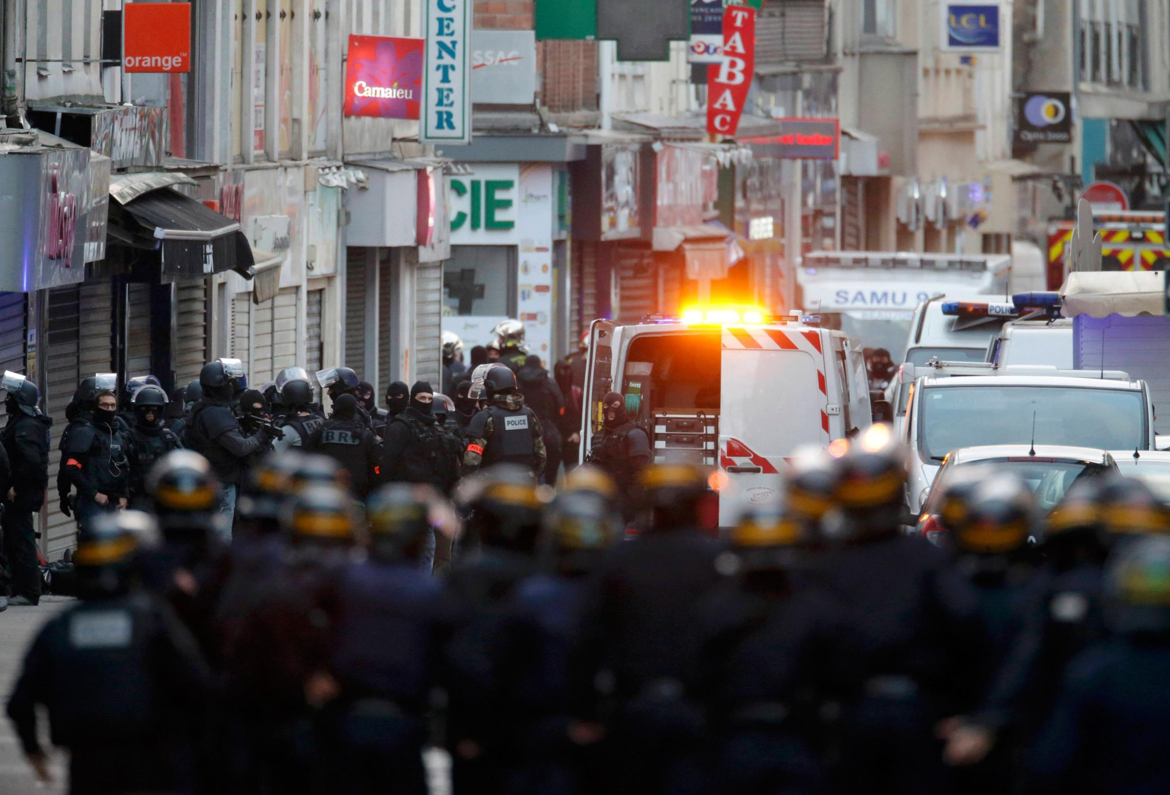 French special police forces secure the area as shots are exchanged in Saint-Denis, France, near Paris