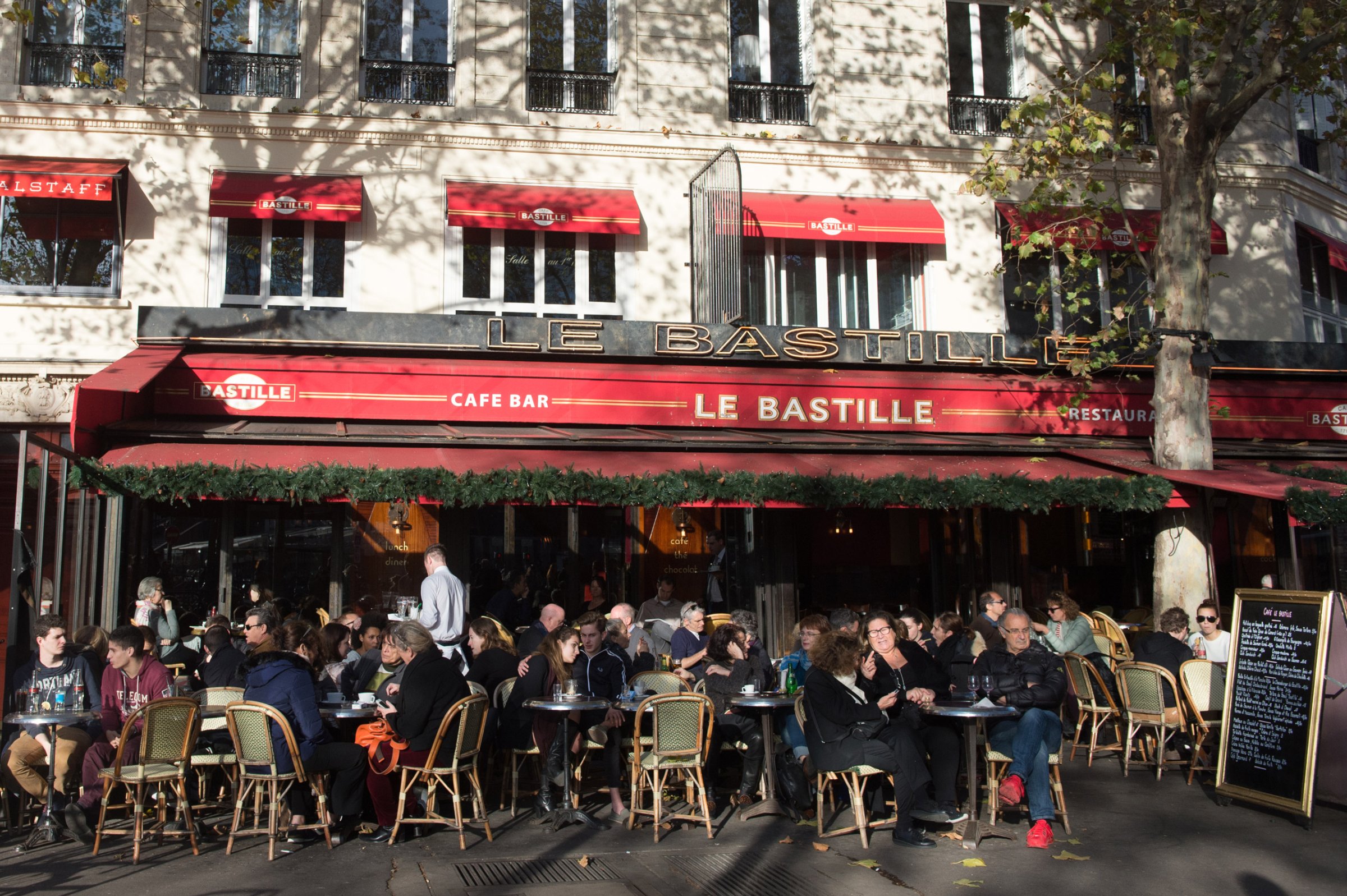 PARIS, FRANCE - NOVEMBER 15: Parisians sitting on the terraces of bars as usual on Sunday in Place de la Bastille on November 15, 2015 in Paris, France. At least 120 people have been killed and over 200 injured, 80 of which seriously, following a series of terrorist attacks in the French capital. (Photo by Thierry Orban/Getty Images)