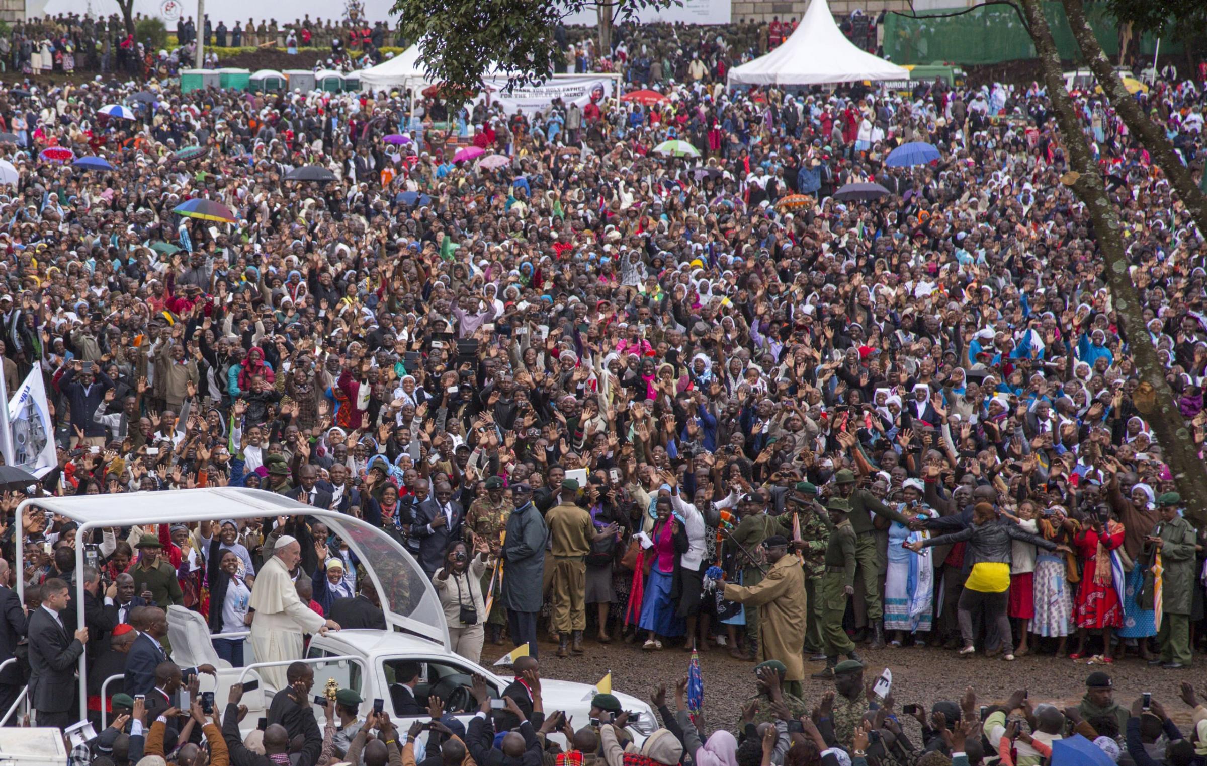 TOPSHOTS Pope Francis waves to the crowd at the University of Nairobi as he arrives to deliver an open-air mass on November 26, 2015. Pope Francis held his first open-air mass in Africa on November 26 with huge crowds calling heavy rains "God's blessing" as they sung and danced in the Kenyan capital. The 78-year-old pontiff, the third pope to visit the continent, is also scheduled to visit Uganda and the troubled Central African Republic (CAR) on a six-day trip. AFP PHOTO / GEORGINA GOODWINGeorgina Goodwin/AFP/Getty Images