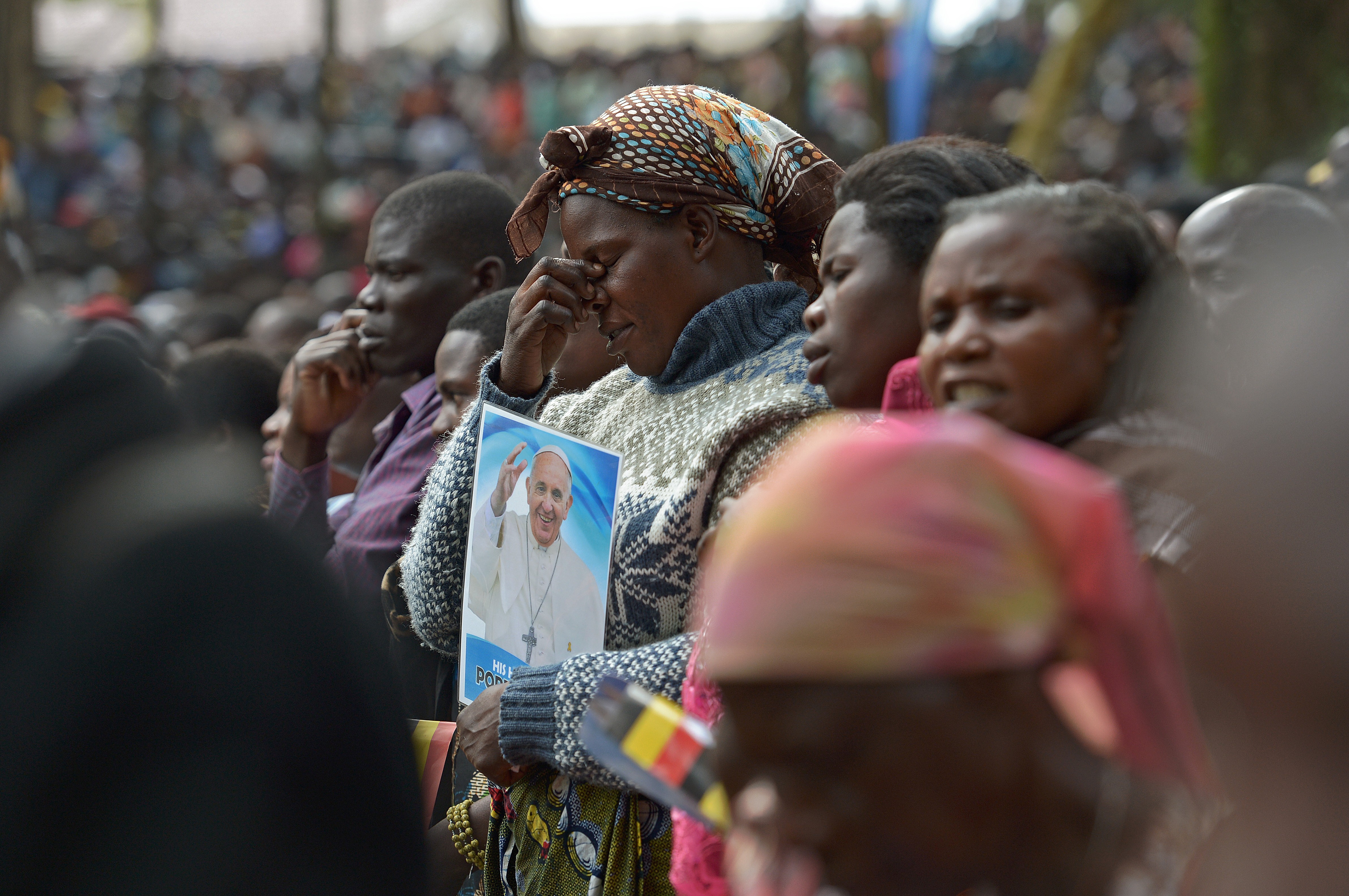 A believer reacts at Namugongo Martyrs' Shrine during an open air mass held by Pope Francis in Uganda on Nov. 28, 2015.