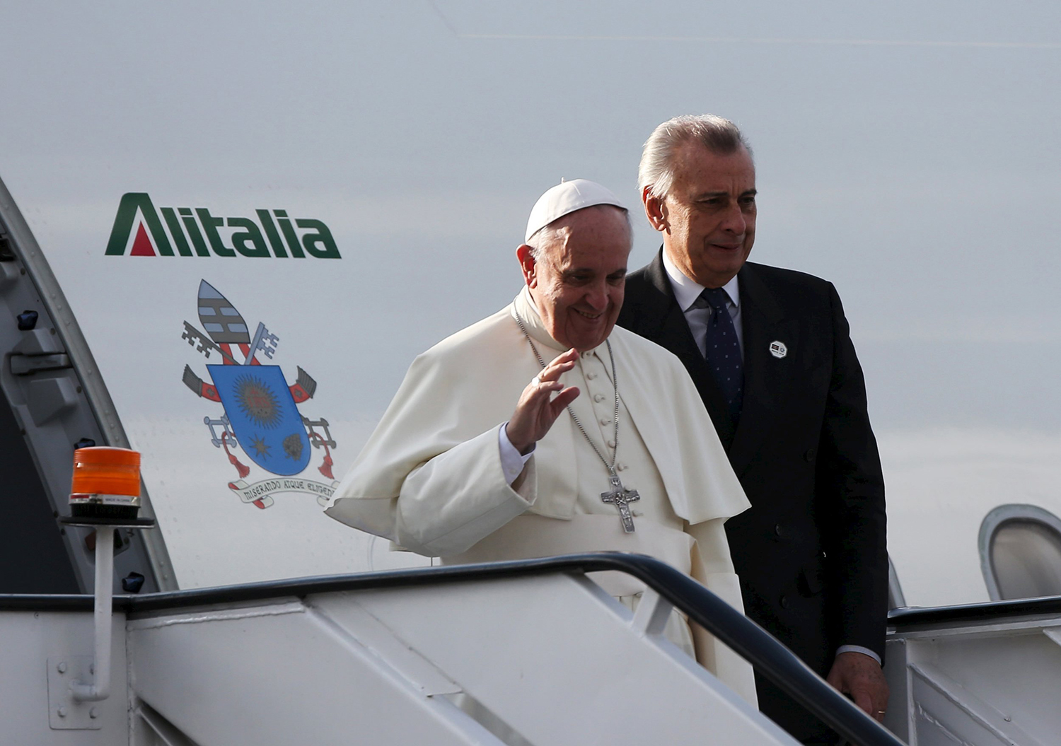 Pope Francis waves upon arrival for first papal visit to African Continent as head of the Catholic Church at the Jomo Kenyatta International Airport in Nairobi