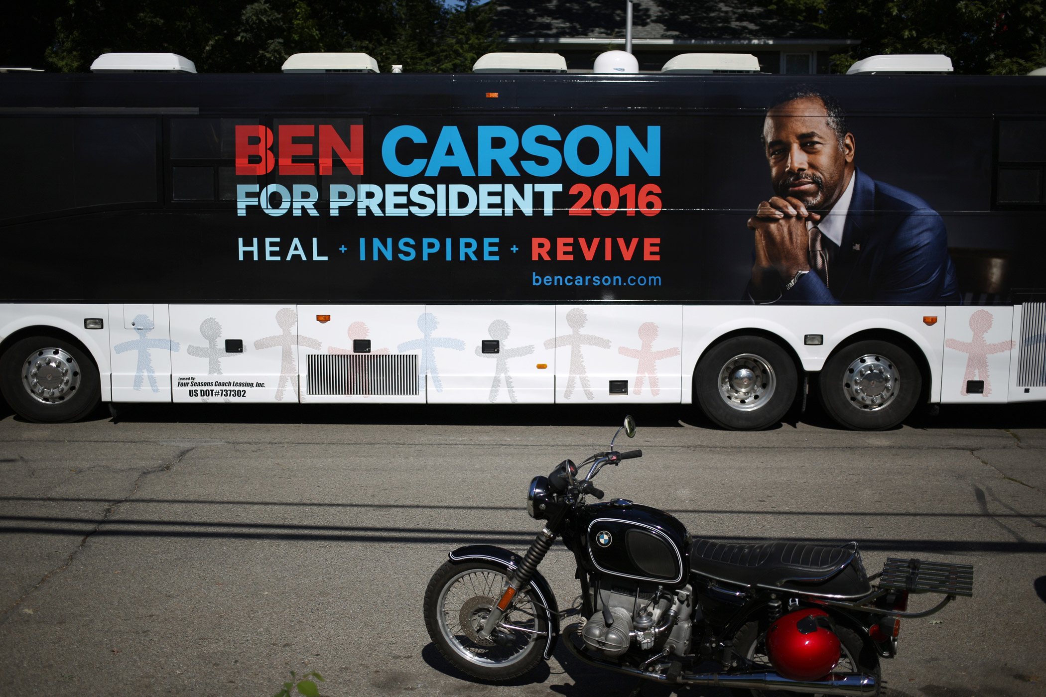 A campaign bus bearing the likeness of presidential candidate Ben Carson is parked near a campaign stop in Jackson, Mich. on Sept. 23, 2015.