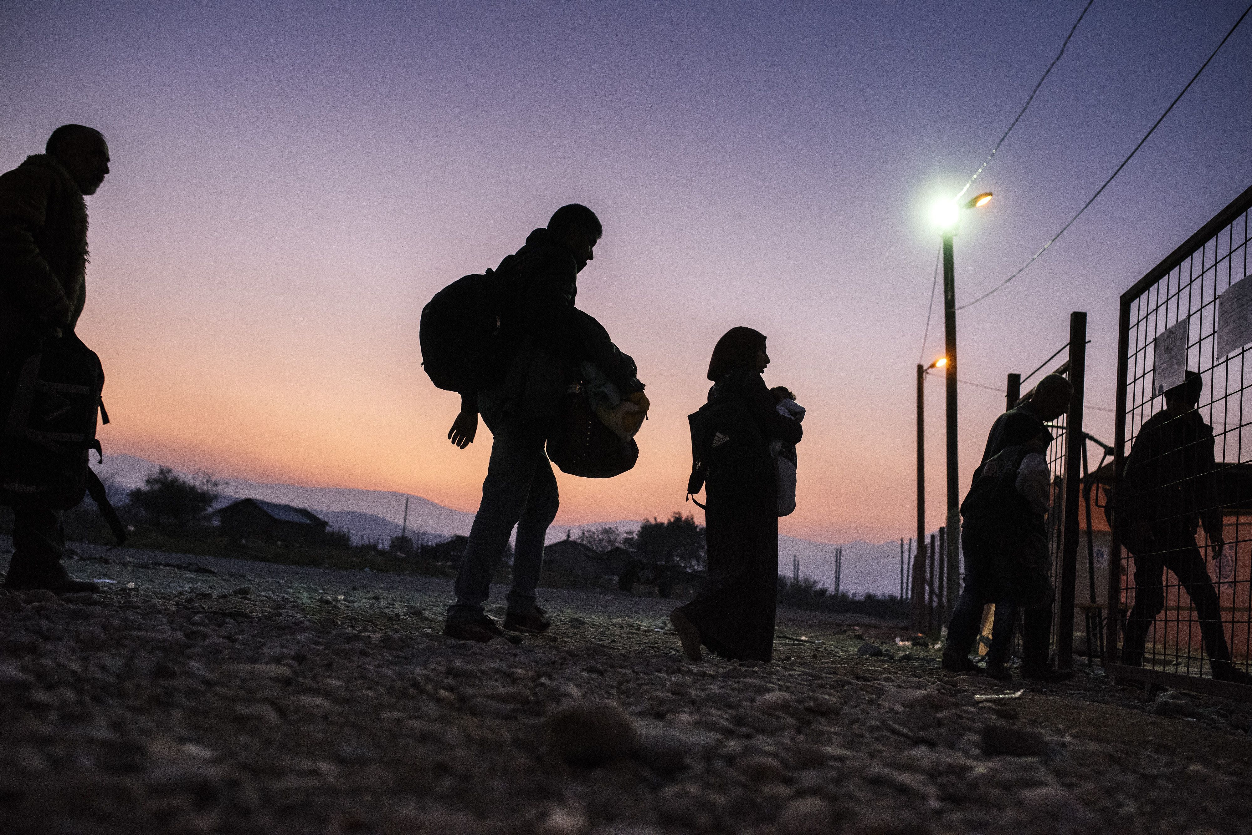 Migrants and refugees enter a registration camp after crossing the Greek-Macedonian border near Gevgelija, Macedonia on Nov. 17, 2015. (Dimitar Dilkoff—Getty Images)