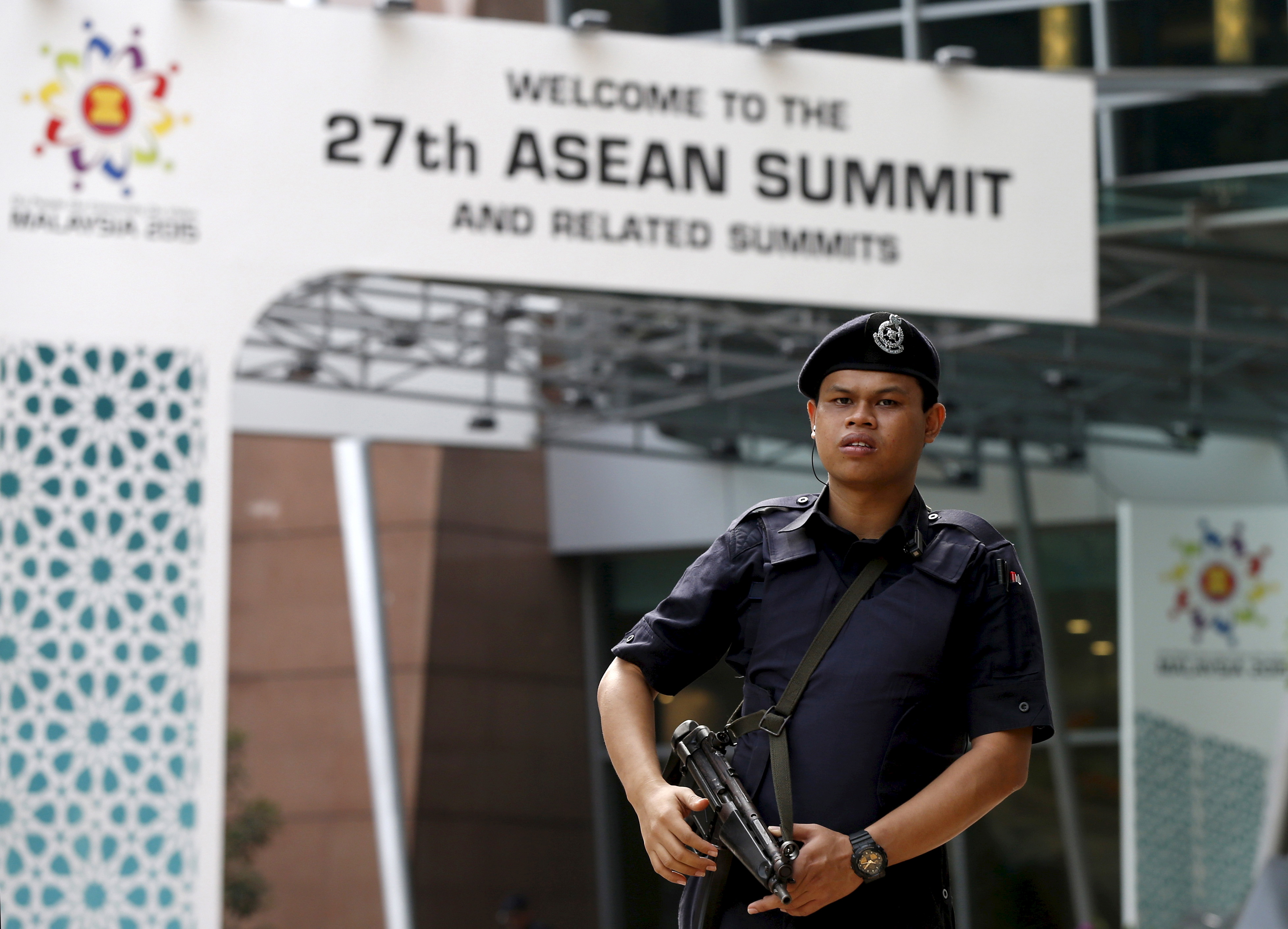 A police officer patrols outside the venue for the 27th Association of Southeast Asian Nations (ASEAN) summit in Kuala Lumpur on Nov. 20, 2015 (Olivia Harris—Reuters)