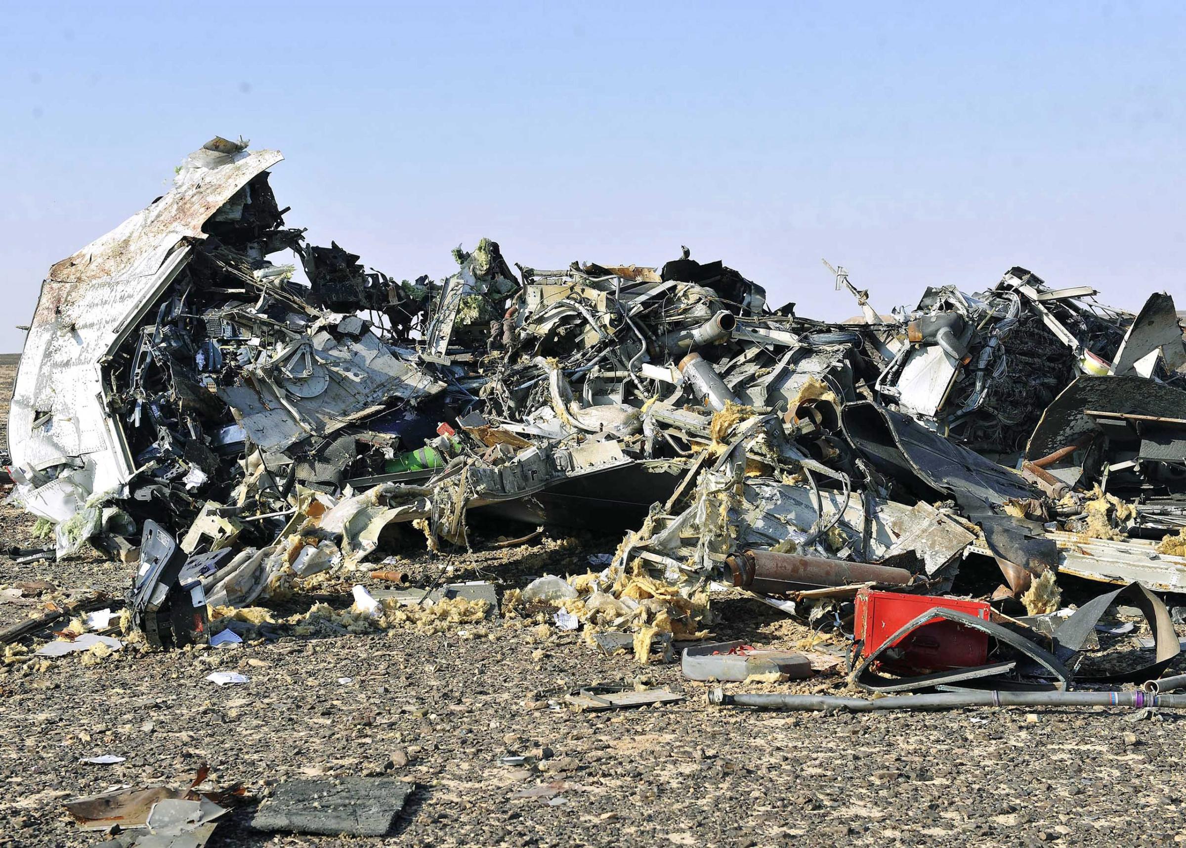 Debris from crashed Russian jet lies strewn across the sand at the site of the crash in the Sinai region in Egypt on Oct. 31, 2015.