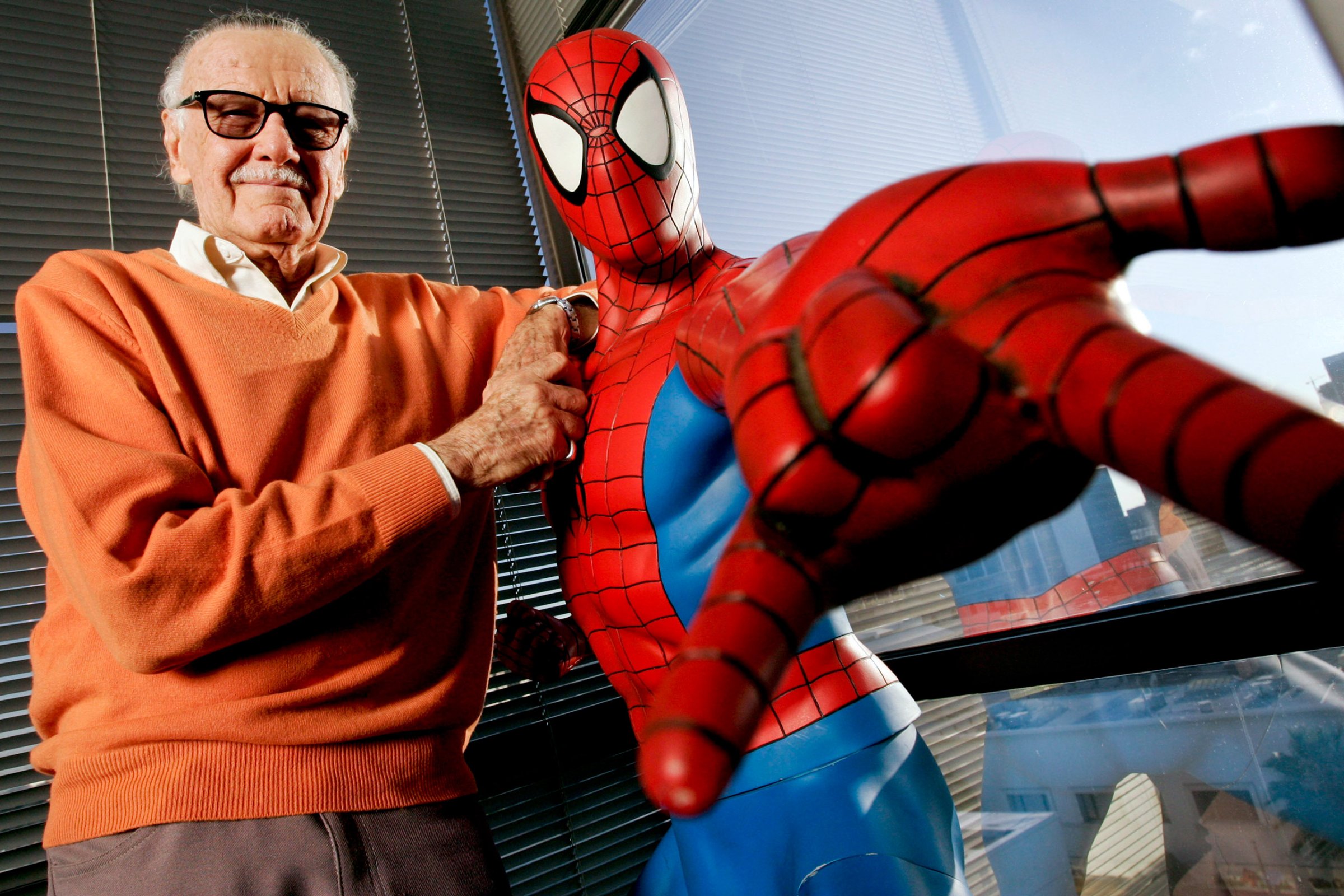 Stan Lee, founder of Marvel Entertainment Inc., poses next t
