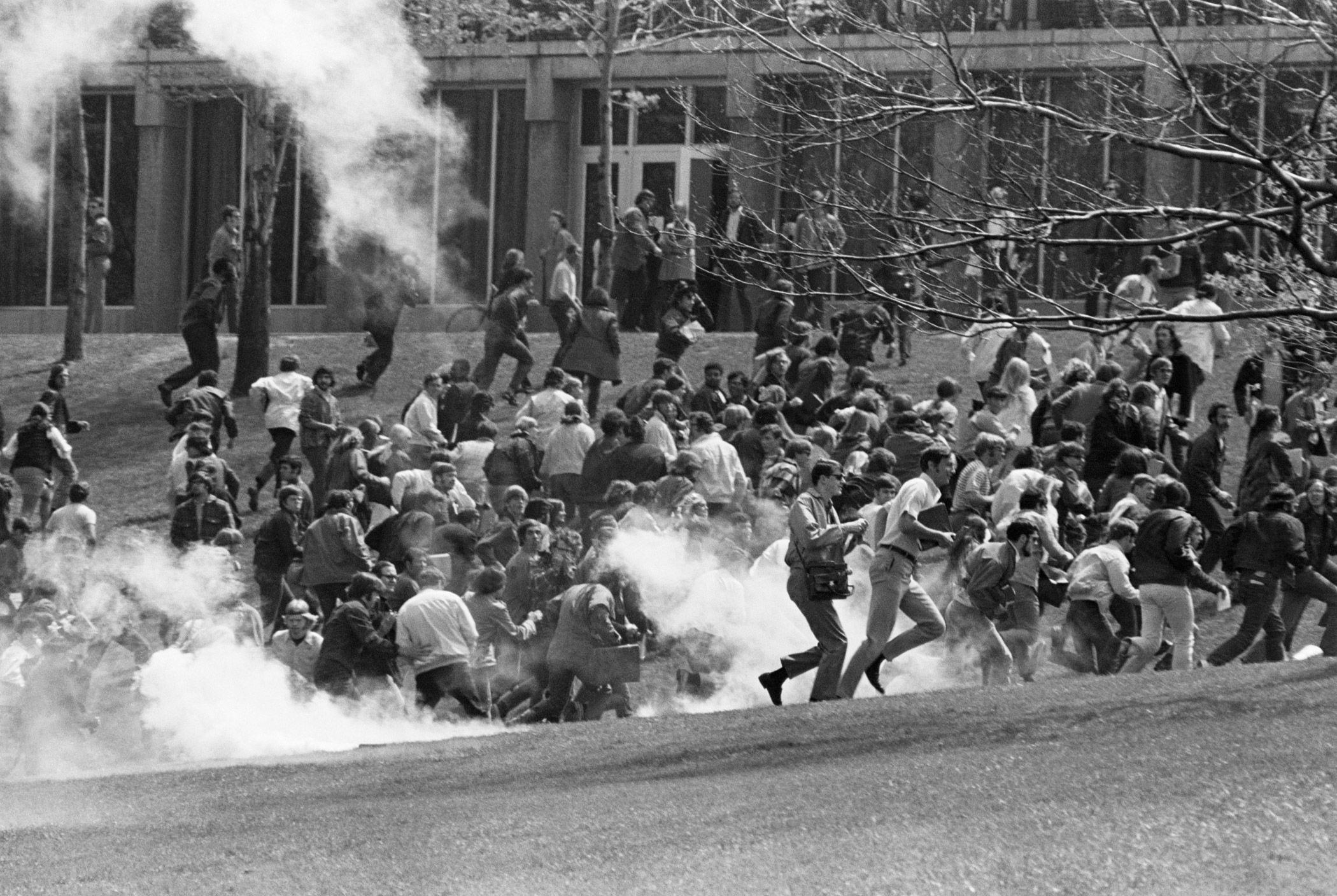 Kent State University students, including anti-war demonstrators, flee as National Guardsmen fire tear gas and bullets into the crowd on May 7, 1970 in Kent, Ohiot. The guardsmen killed four students and wounded nine others.