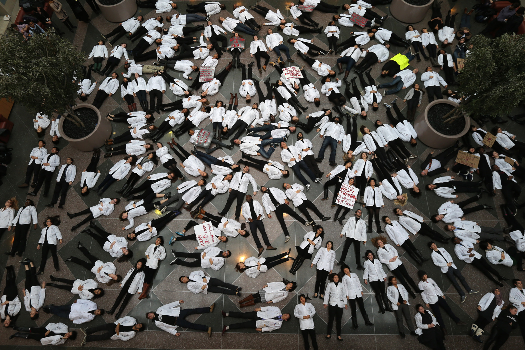 Students participate in a die-in at Harvard Medical School Medical Education Center on Dec. 10, 2014. The protest was held in response to the decisions by authorities to not bring indictments in the police killings of Michael Brown in Ferguson, Mo., and Eric Garner in New York. The Black Lives Matter movement has found support at campus's across the country.