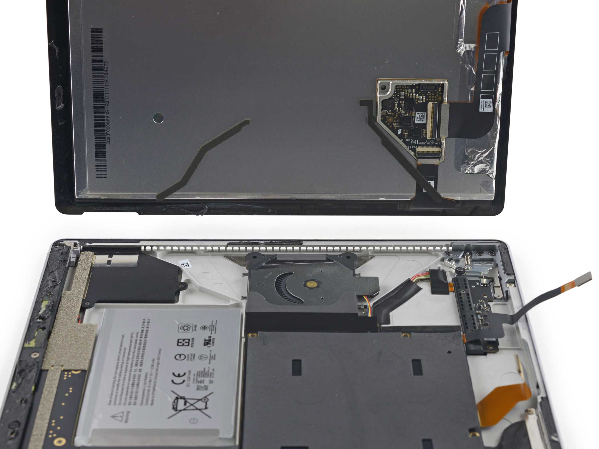 Cables connecting the Surface Book's display to the motherboard are detached.