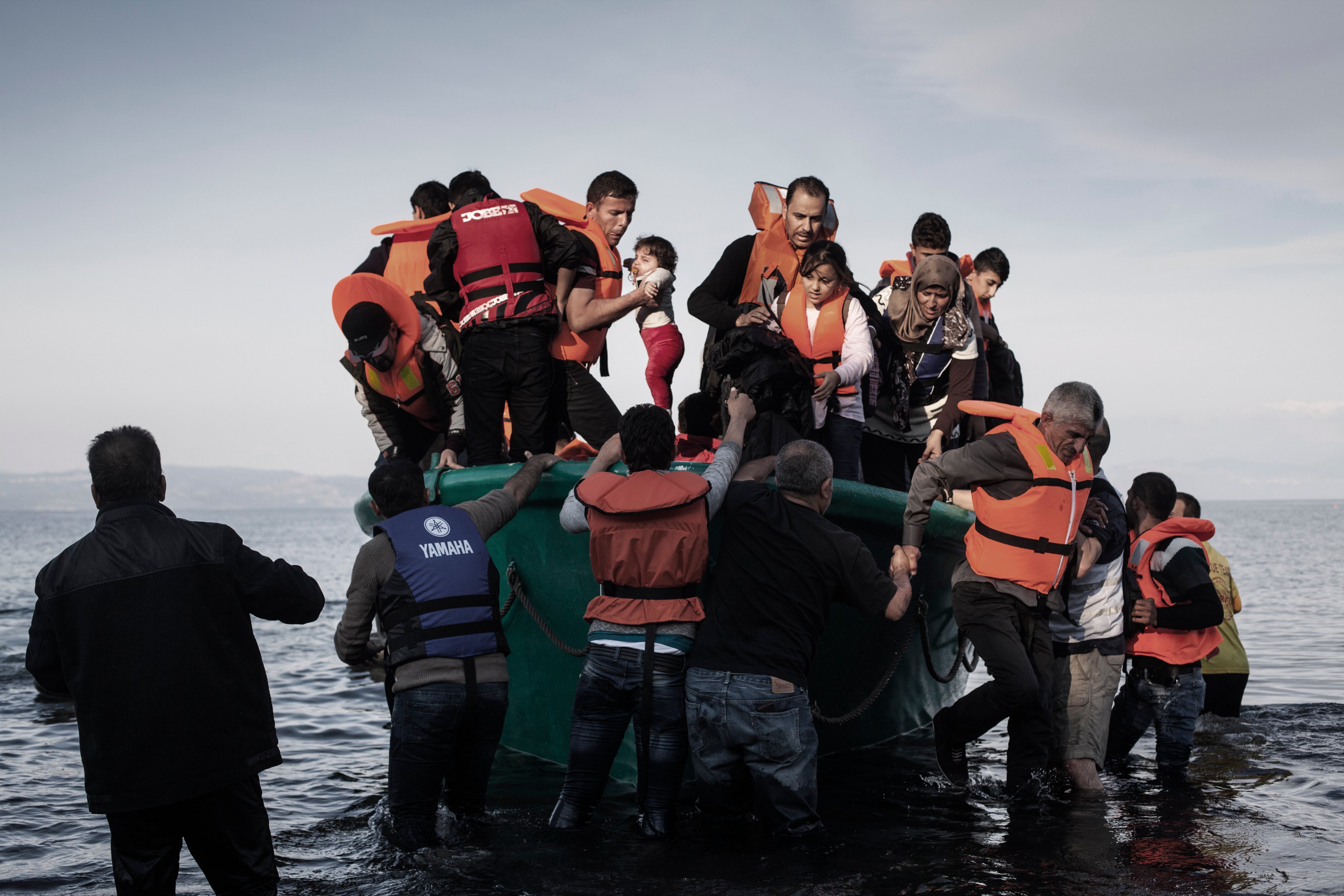 Refugees from Afghanistan and Syria arrive in boats on the shores of Lesbos near Skala Sikaminias, Greece on Nov. 10 2015. (Etienne de Malglaive—Getty Images)