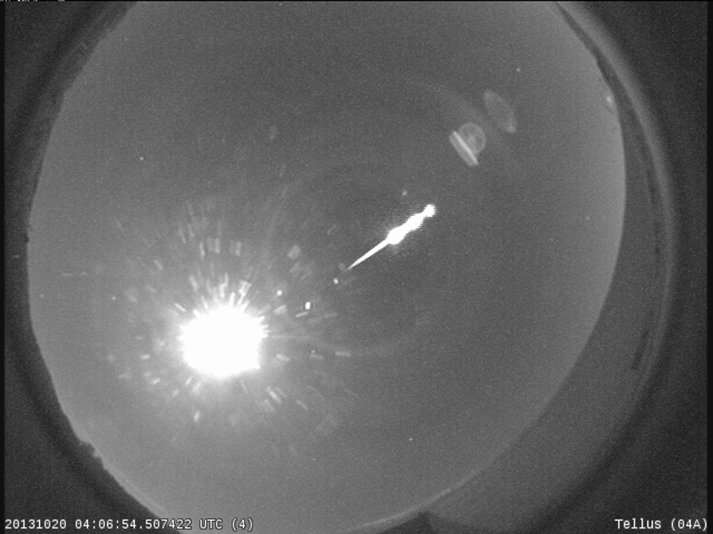 A bright Taurid fireball recorded by the NASA All Sky Fireball Network station in Cartersville, Georgia, in 2013. The bright orb is the Moon.