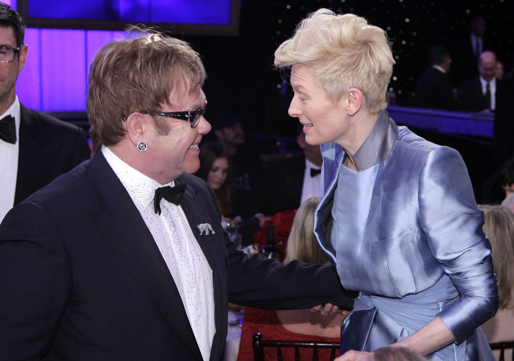 Elton John and Tilda Swinton are seen during the 69th Annual Golden Globe Awards on Jan. 15, 2012 in Beverly Hills, Calif.