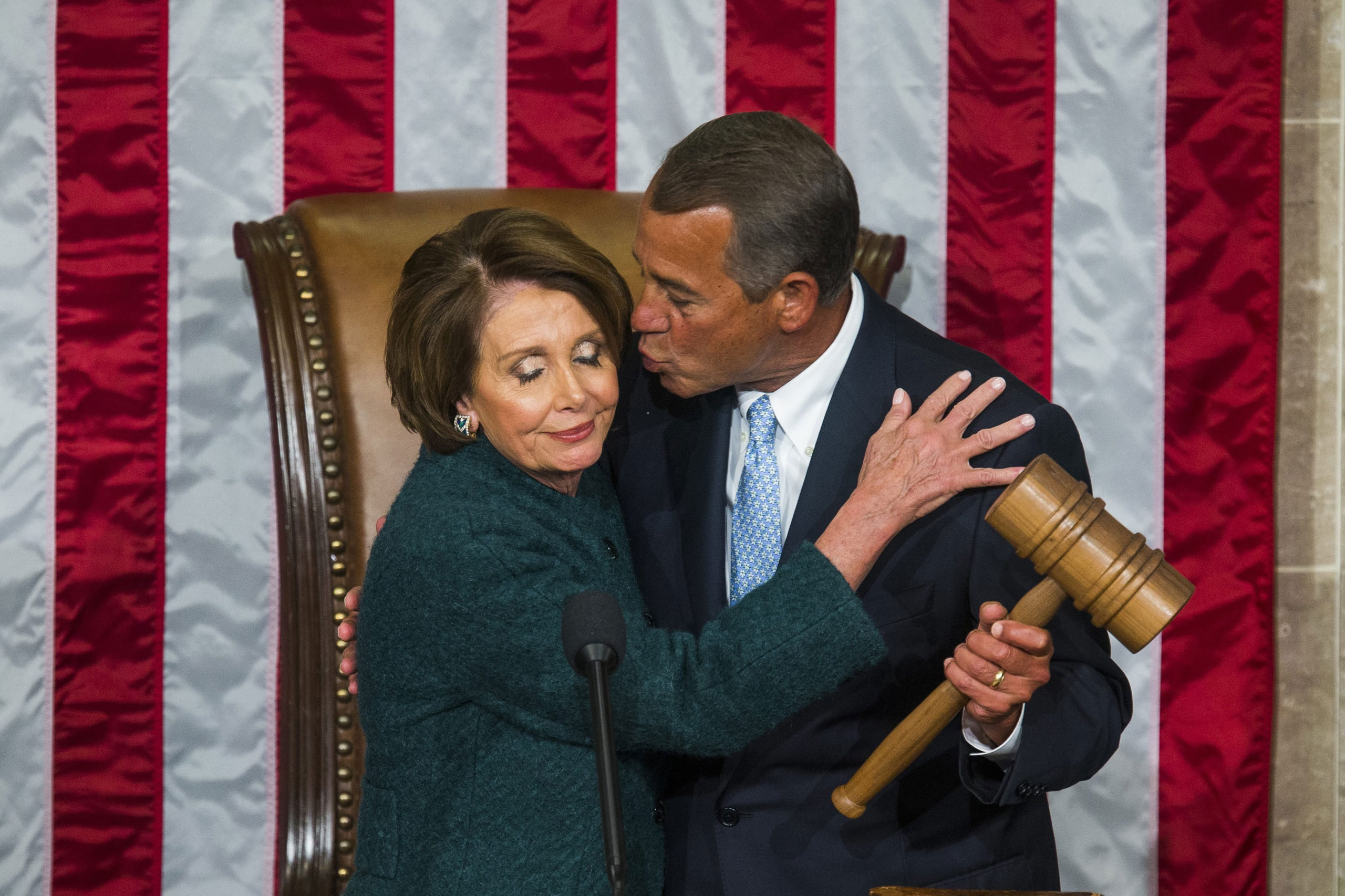 Former Republican Speaker of the House John Boehner kisses Democratic House minority leader Nancy Pelosi after Boehner was re-elected as Speaker of the House on the floor of the House of Representatives in the U.S. Capitol in Washington, D.C. Jan. 6, 2015.