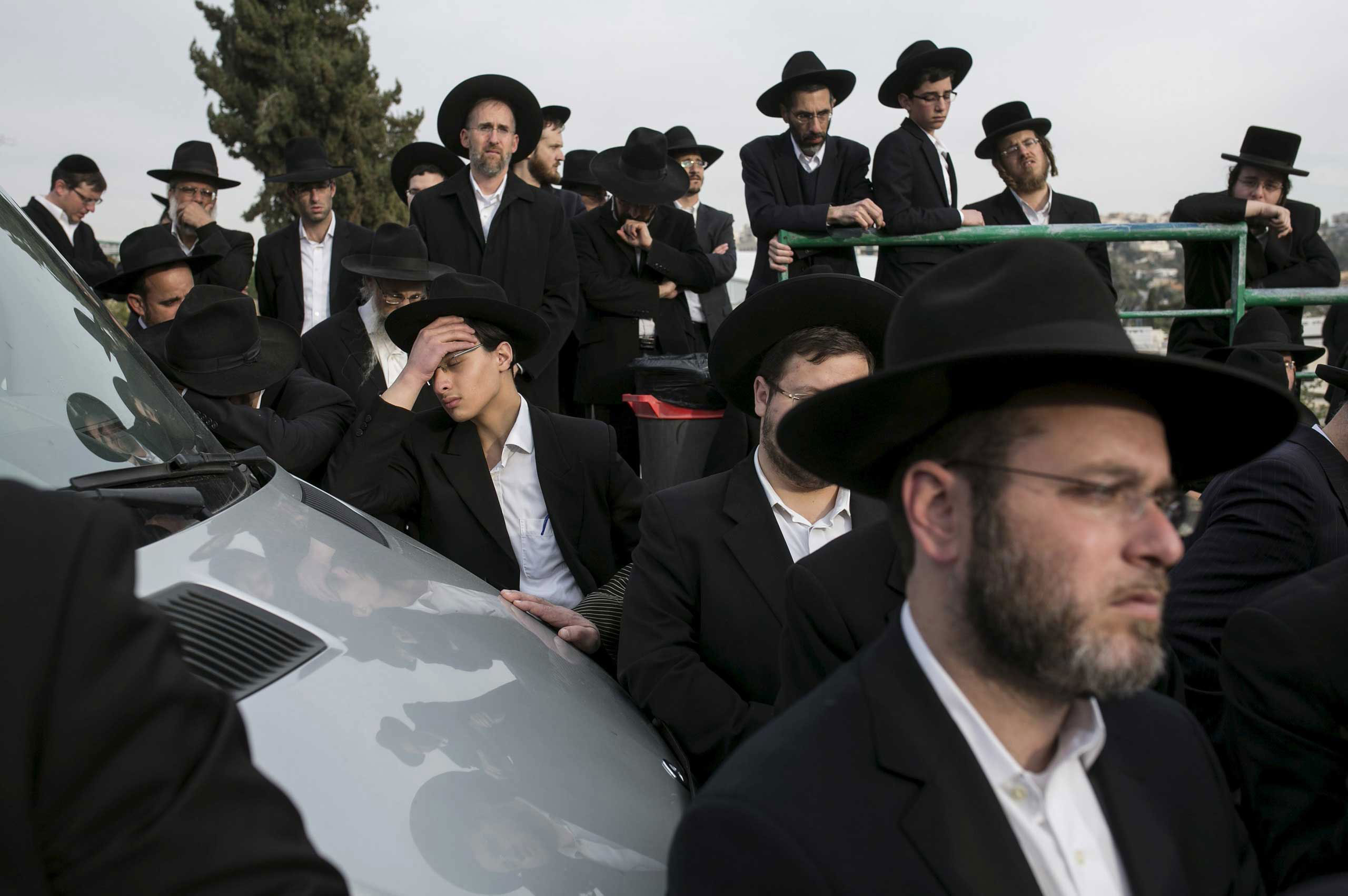 Mourners gather during the funeral service for seven children from the Sassoon family, who died in a house fire in Brooklyn, NY, before their burial in Jerusalem. March 23, 2015.