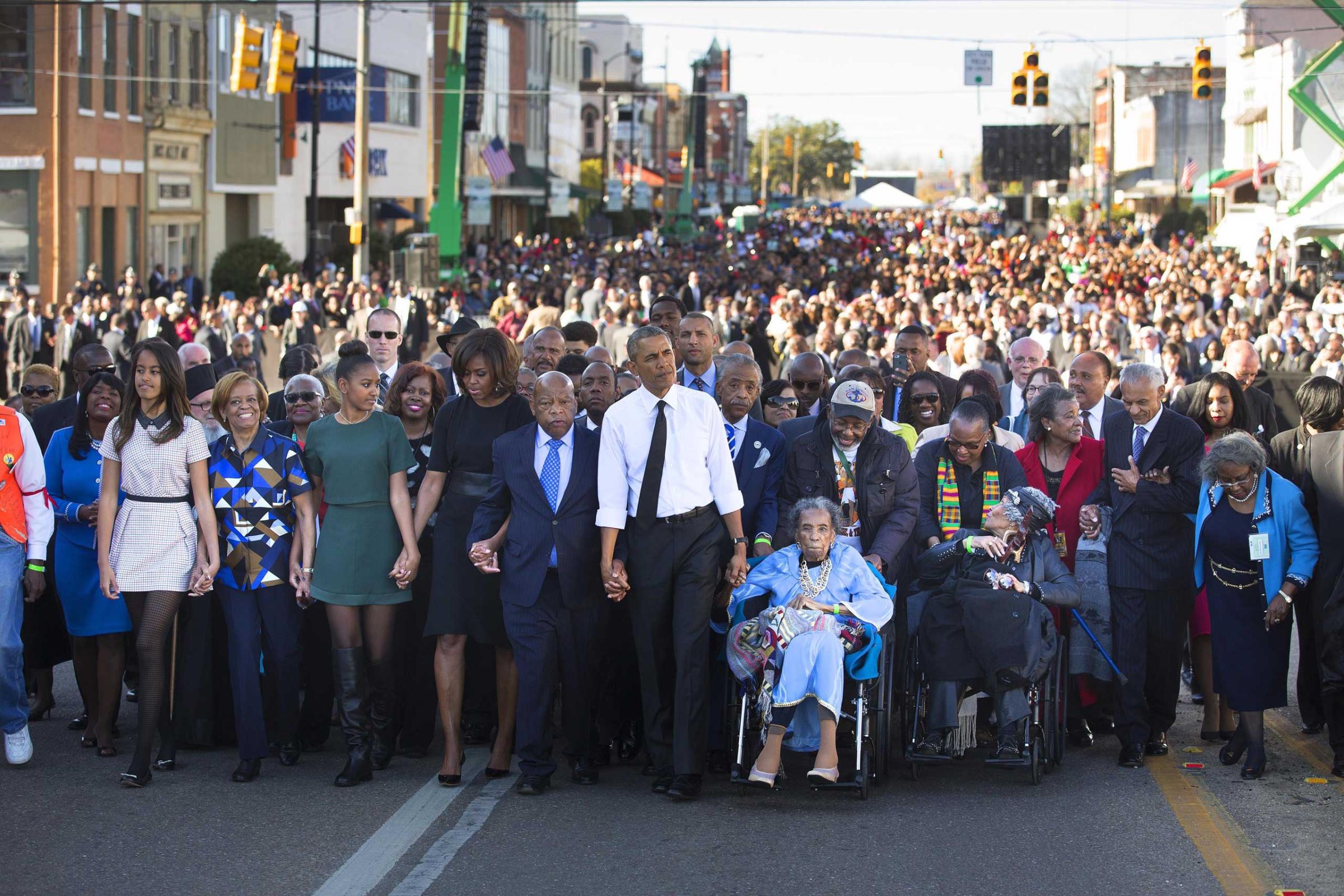 President Barack Obama, Amelia Boynton, right, Rep. John Lewis (D-Ga.) and the first family lead a march toward the Edmund Pettus bridge, 50 years to the day after Bloody Sunday in Selma, Ala. In an address, Obama rejected the notion that race relations have not improved in the years since—as well as the notion that racism has been defeated. March 7, 2015