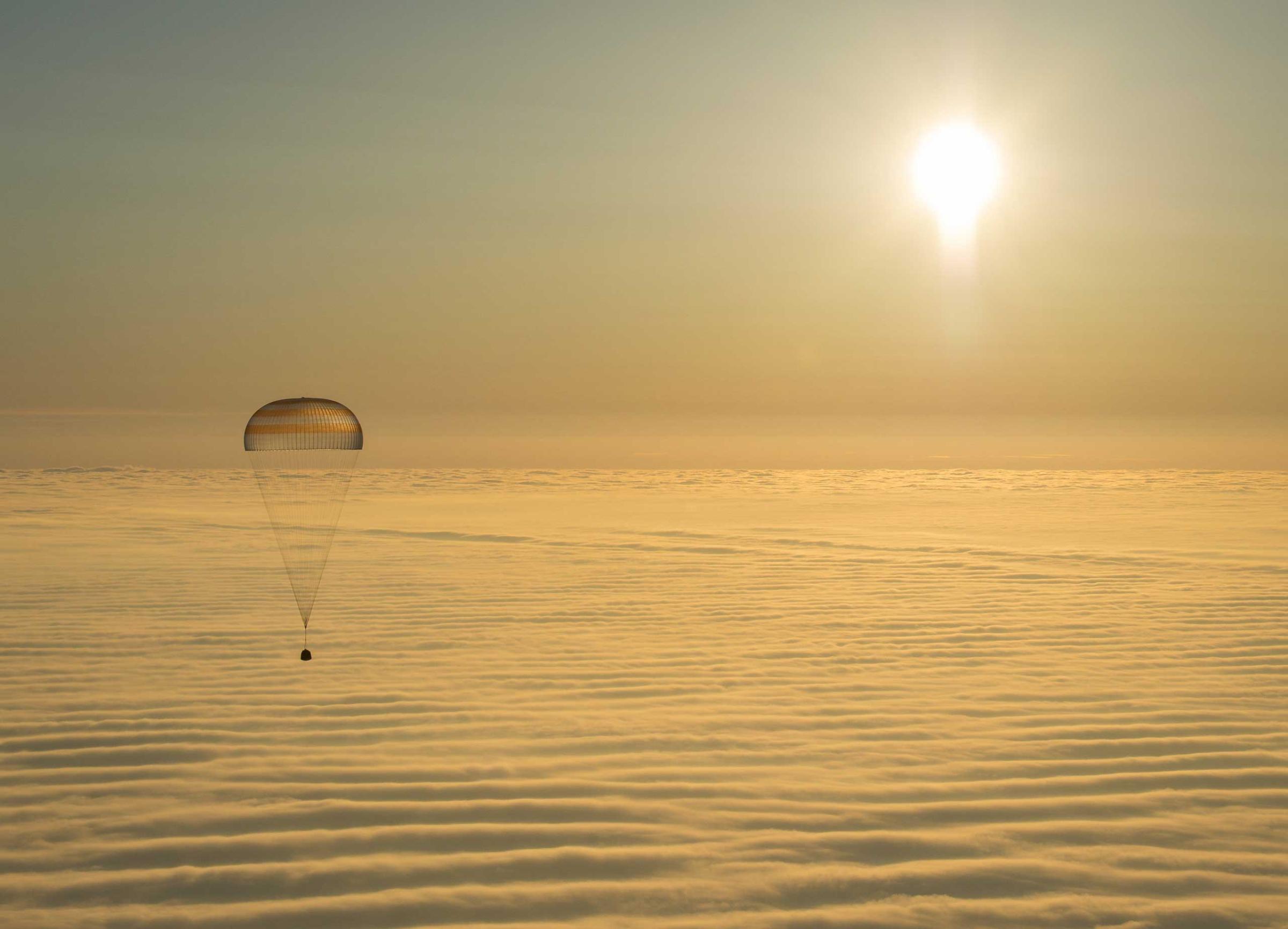 The Soyuz TMA-14M spacecraft is seen as it lands with Expedition 42 commander Barry Wilmore of NASA, Alexander Samokutyaev of the Russian Federal Space Agency (Roscosmos) and Elena Serova of Roscosmos near the town of Zhezkazgan, Kazakhstan. NASA Astronaut Wilmore, Russian Cosmonauts Samokutyaev and Serova are returning after almost six months onboard the International Space Station where they served as members of the Expedition 41 and 42 crews. March 12, 2015
