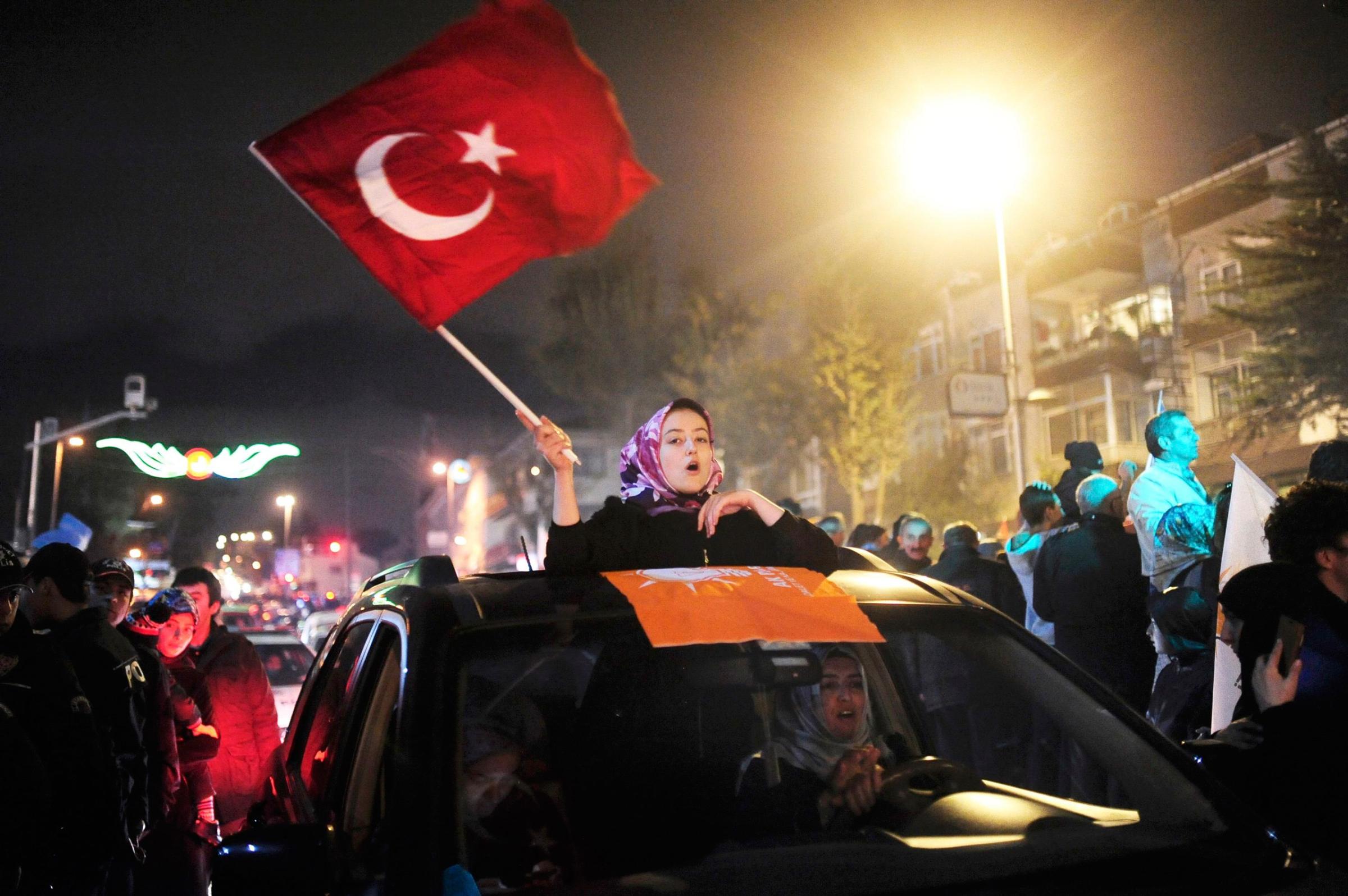 Supporters of AK Party gather near the residence of Turkish President Tayyip Erdogan to celebrate their party's election victory in Istanbul, Turkey