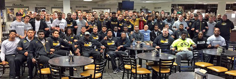 A photo tweeted by Missouri football coach Gary Pinkel on Nov. 8, 2015 shows the University of Missouri football players locked arm in arm in Columbia, Mo.