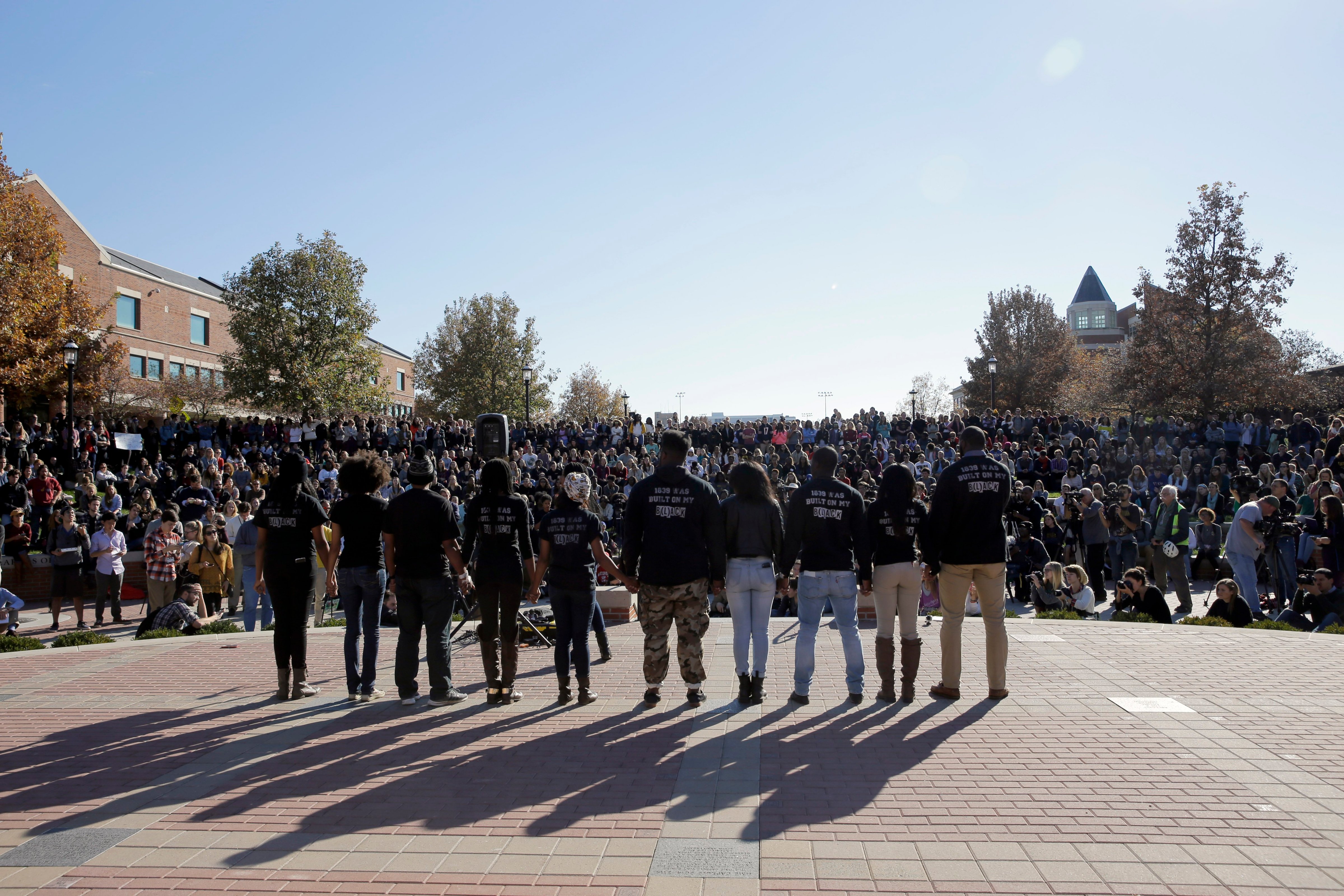 Members of black student protest group following the announcement University of Missouri System President Tim Wolfe would resign, on Nov. 9, 2015. (Jeff Roberson—AP)