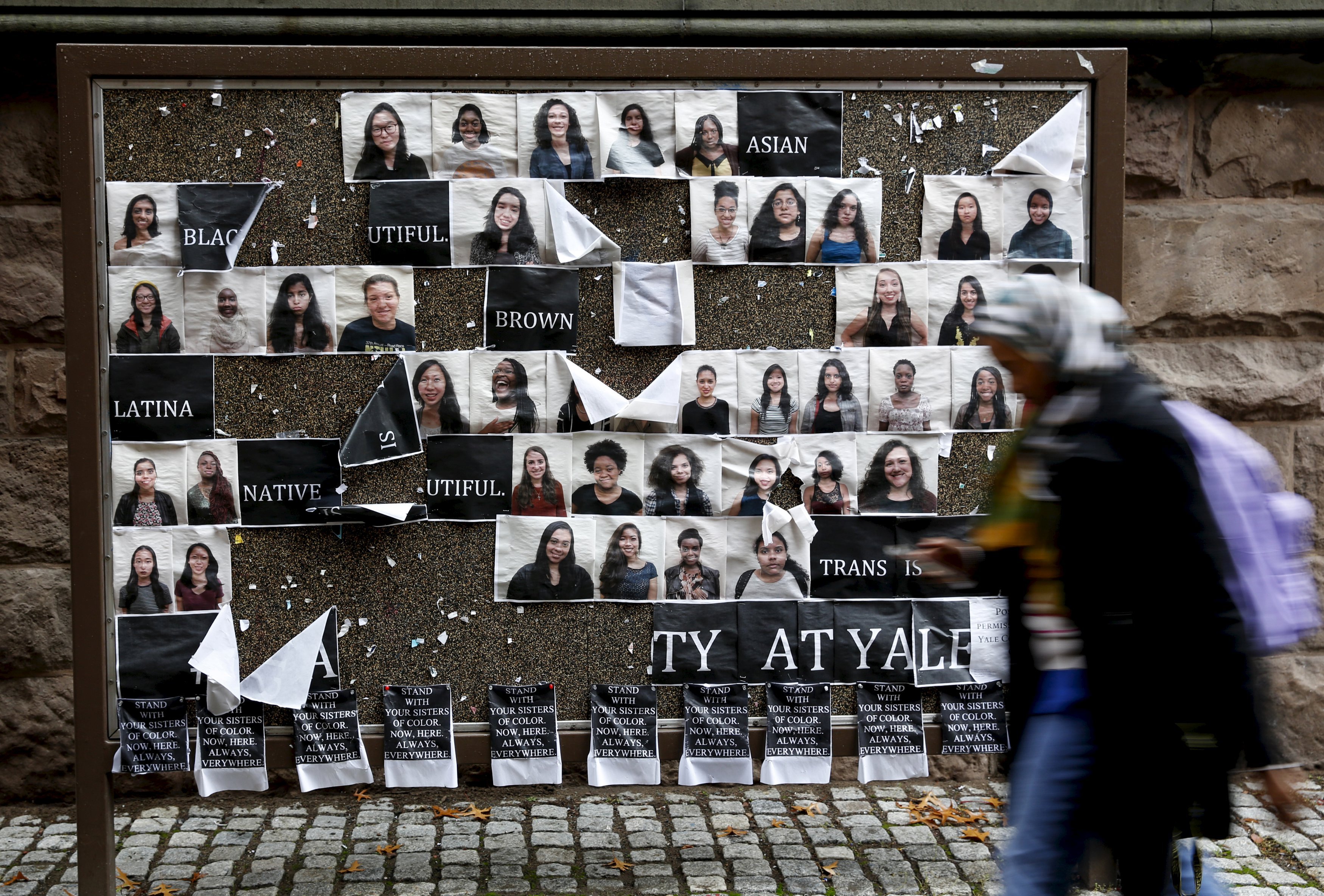 A student walks by a college noticeboard on campus at Yale University in New Haven, Connecticut on Nov. 12, 2015. (Shannon Stapleton—Reuters)