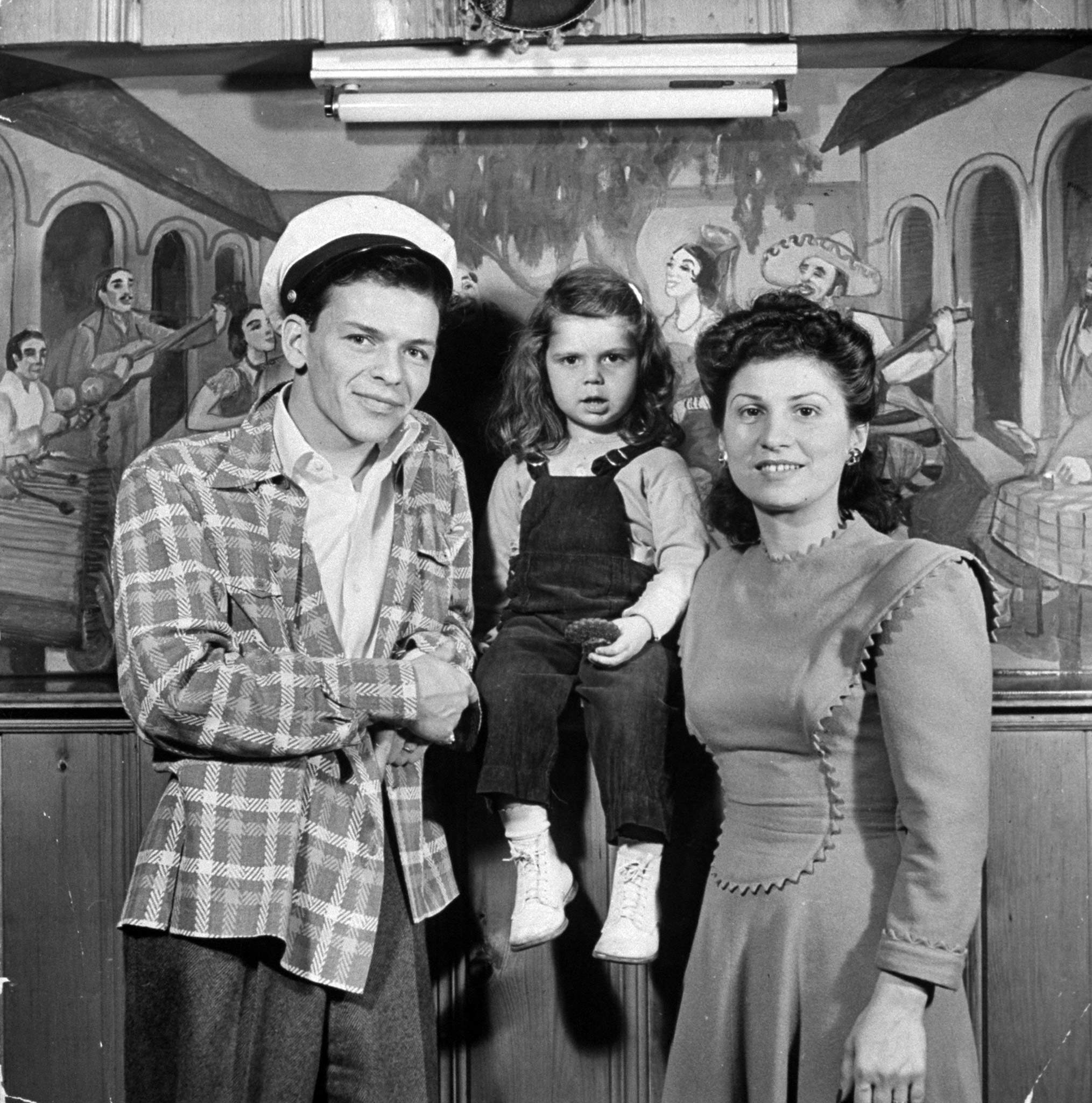 Frank Sinatra with wife Nancy and 3 yr-old daughter Nancy Jr.at home, 1943.