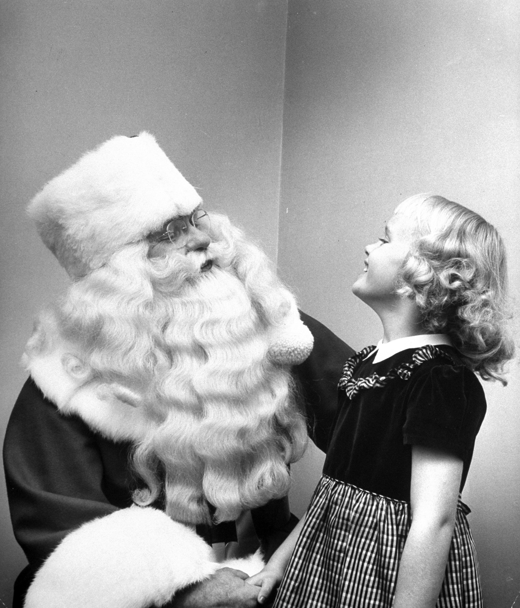 Santa Claus with a young girl, 1948.