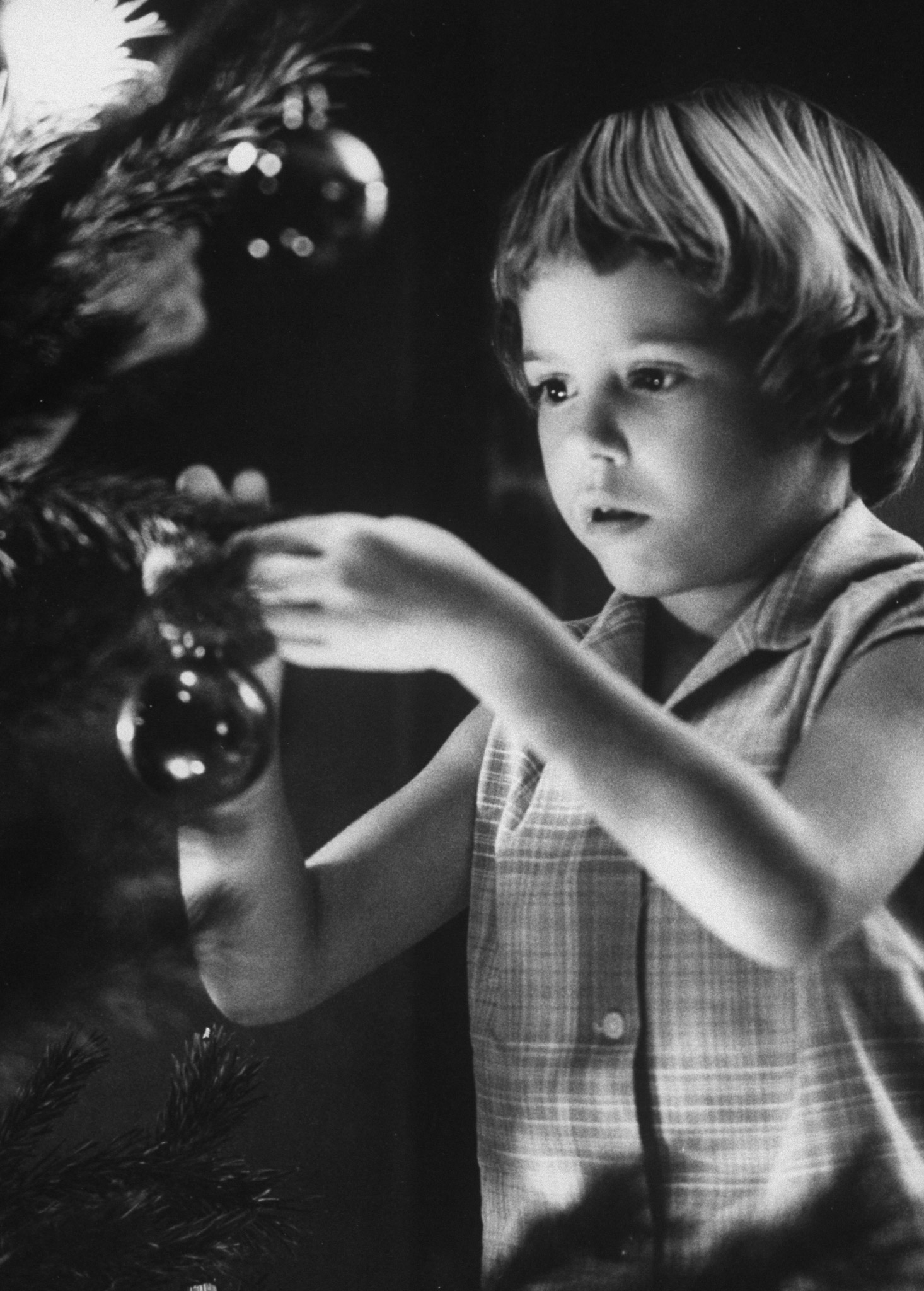 Tina Smith decorating a Christmas tree at Guantanamo Naval Base, where her dad, Lt. Commander Joe Smith is stationed, 1962.
