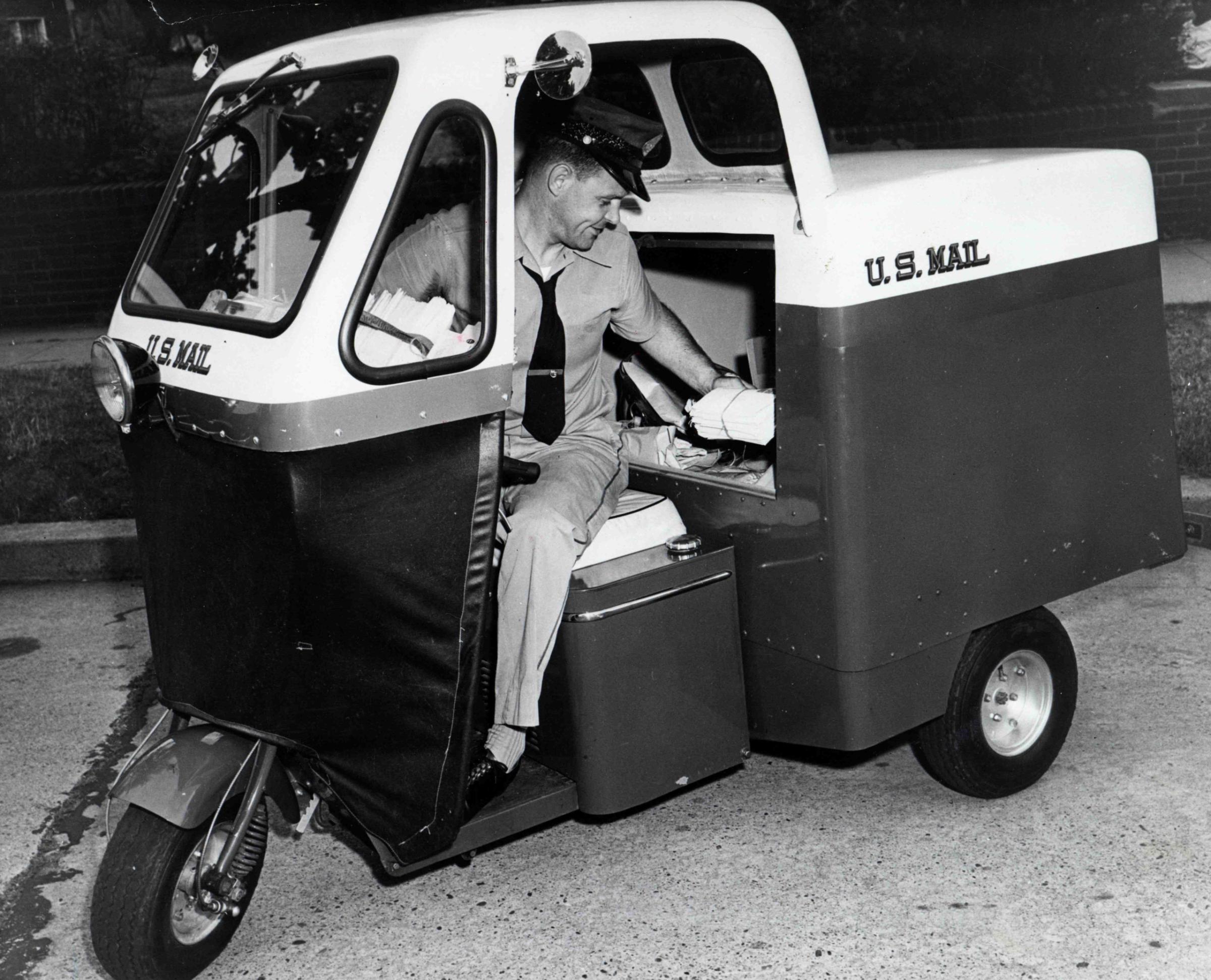 City letter carrier seated in a three-wheeled "mailster" motor vehicle. Carriers used these vehicles to carry the ever-increasing amounts of mail that was being delivered to American households after end of the Second World War. The mailster worked best in temperate climates or on even terrain. In other areas, they sometimes did not work at all. Northern carriers, immobilized in as little as three inches of snow, also complained of the vehicles' inability to heat properly. The three-wheel design left mailsters susceptible to tipping over if cornering over 25 miles per hour or if caught in a wind gust. One carrier complained that his mailster was tipped over by a large dog.