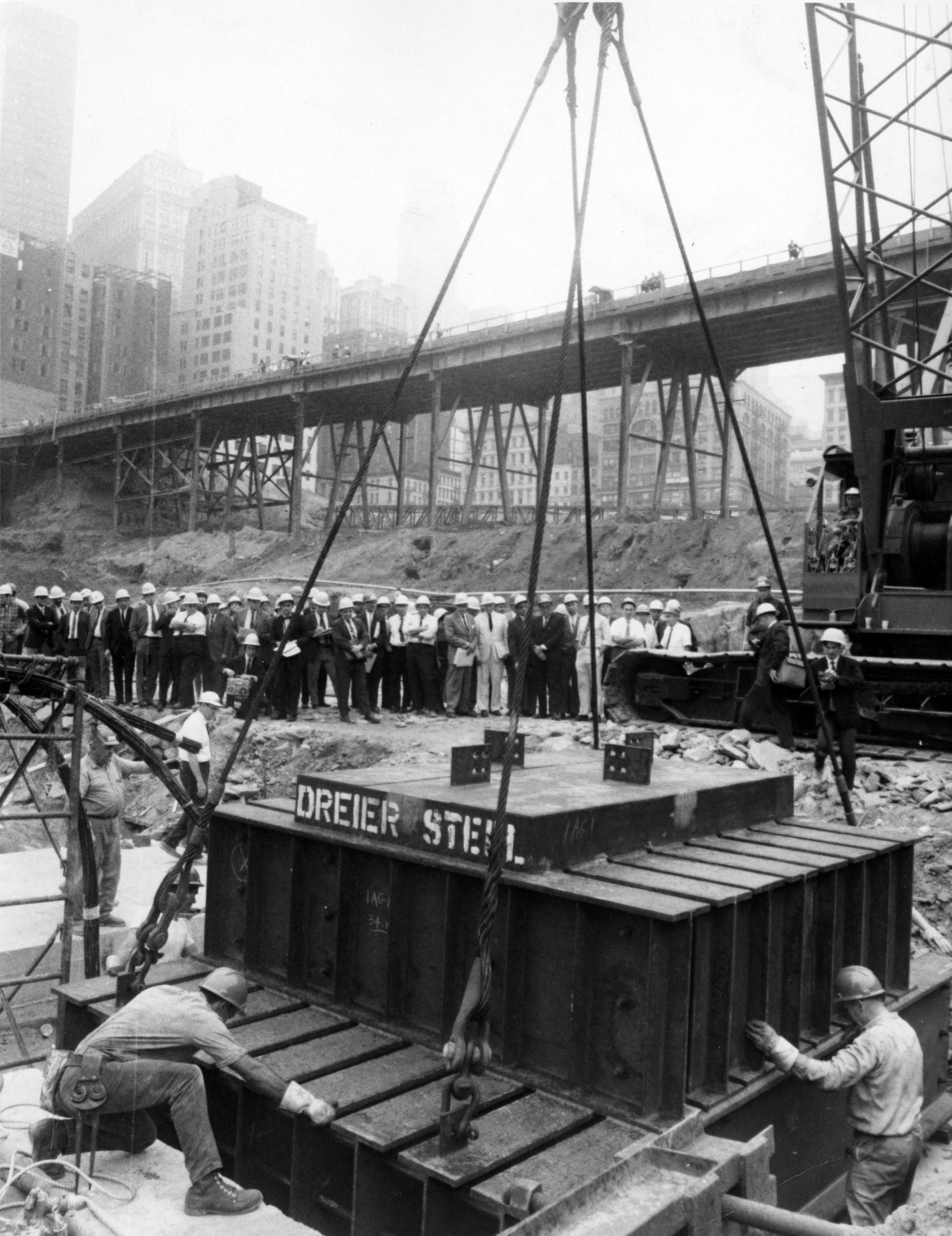 Steelworkers guide a 34-ton steel grillage—the first of 28 that will support the North Tower's core columns—into place 70 feet below street level at the site of the World Trade Center in New York, Aug. 6, 1968.