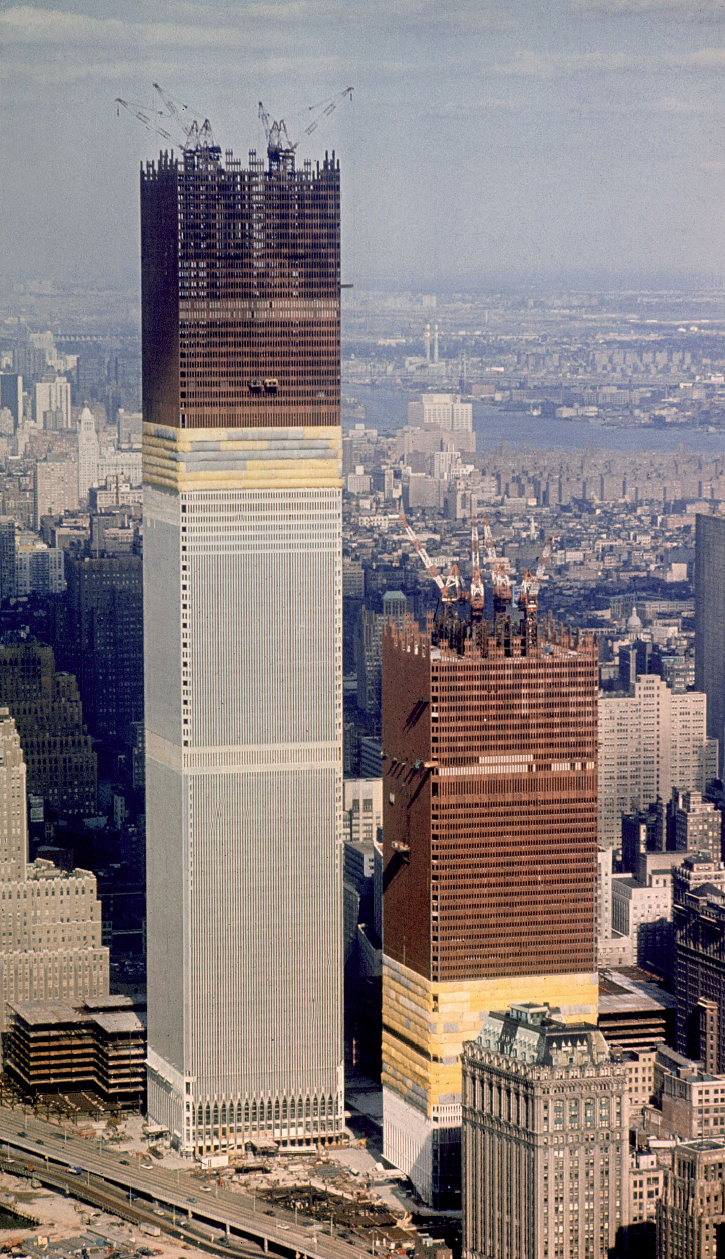 Workers add a new section to the top of the World Trade Center Building in New York, October 23, 1970, making its height some 1,254 feet, four feet taller than the Empire State Building.