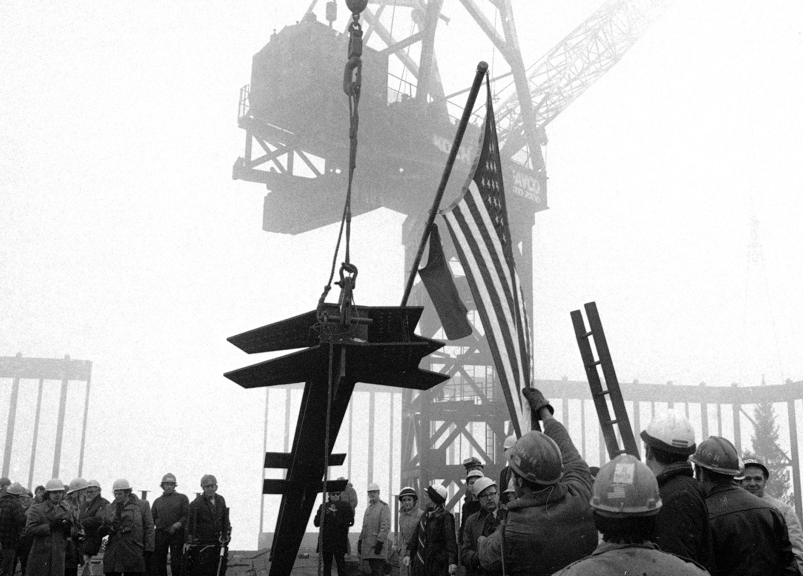 A 36-foot long, 4-ton column is hoisted atop the new world's tallest building, the World Trade Center, still under construction in New York City, Dec. 23, 1970.