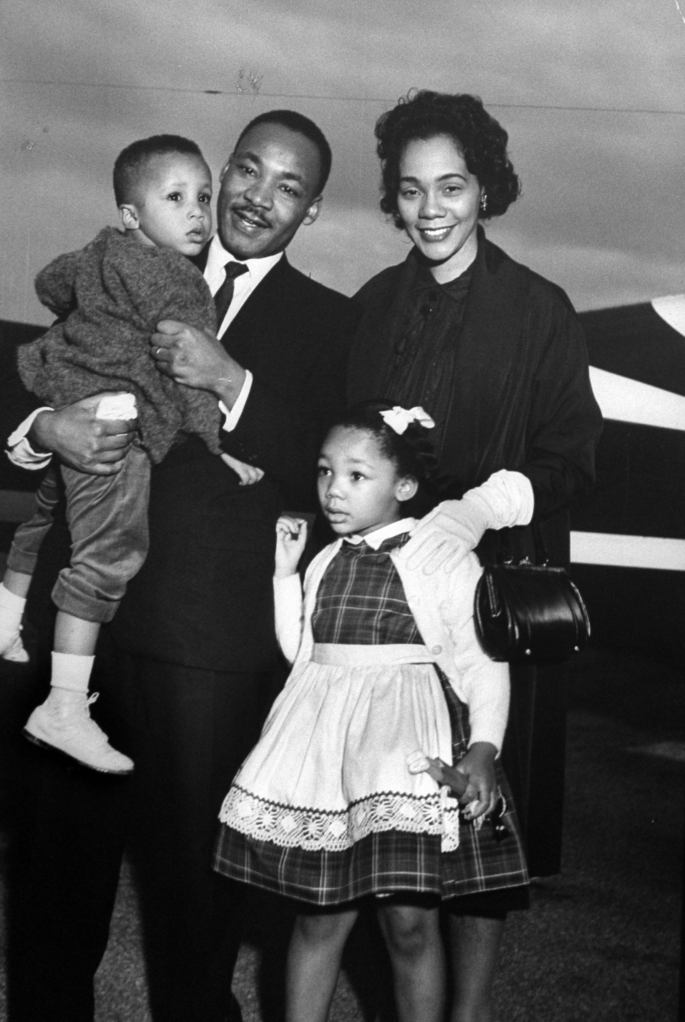 Martin Luther King Jr. holding his son Martin III as his daughter Bernice and wife Coretta greet him at the airport upon his release from Georgia State prison after incarceration for leading boycotts, 1960.
