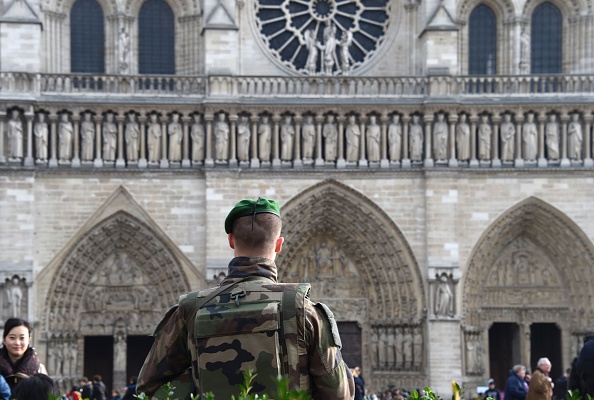 A French soldier patrols next to the Notre-Dame cathedral in Paris on December 24, 2015 as part of security measures set following the Nov. 13 Paris terror attacks. (Dominique Faget—AFP/Getty Images)