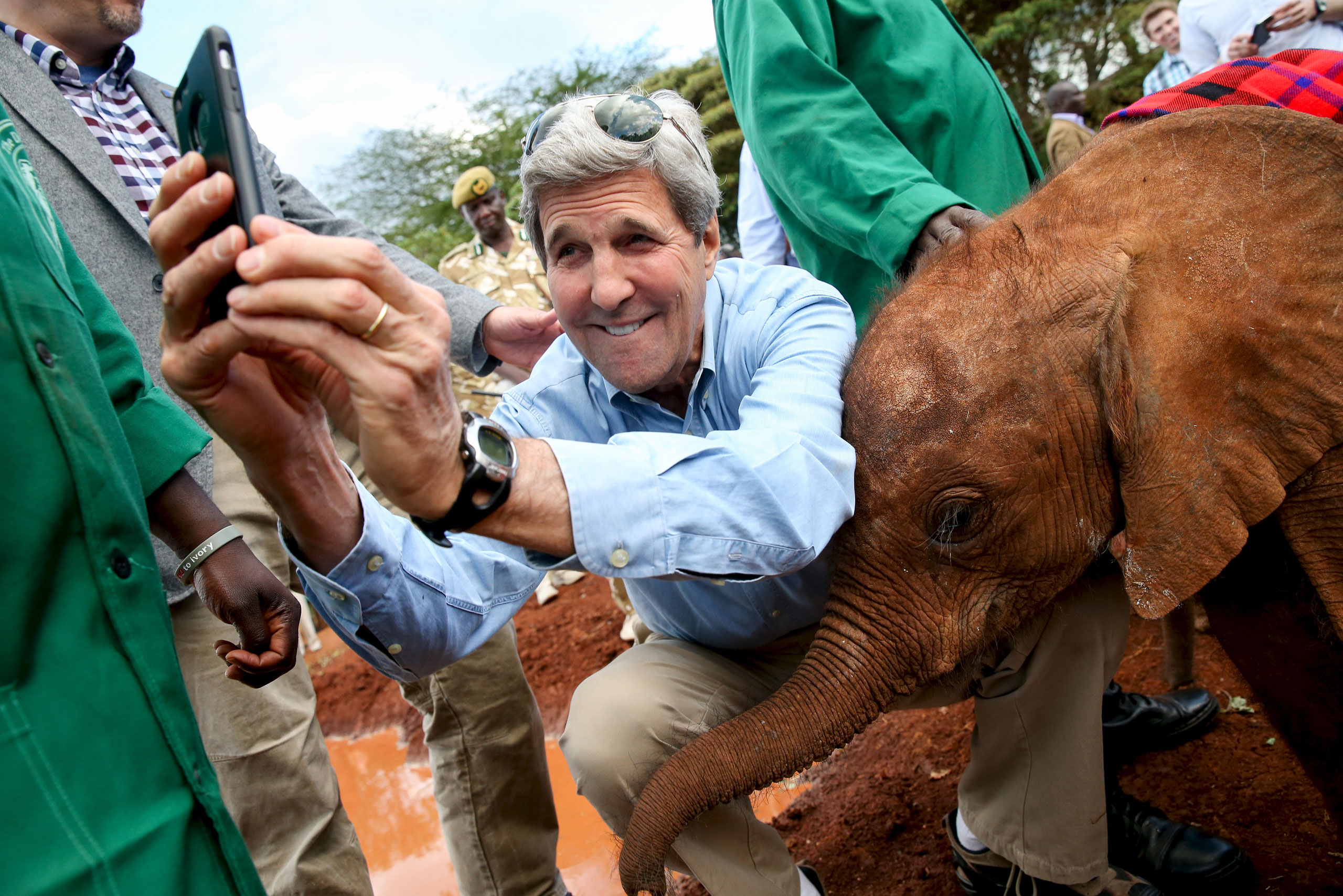 U.S. Secretary of State John Kerry takes a selfie with a baby elephant while touring the Sheldrick Center Elephant Orphanage at the Nairobi National Park, Kenya, May 3, 2015.